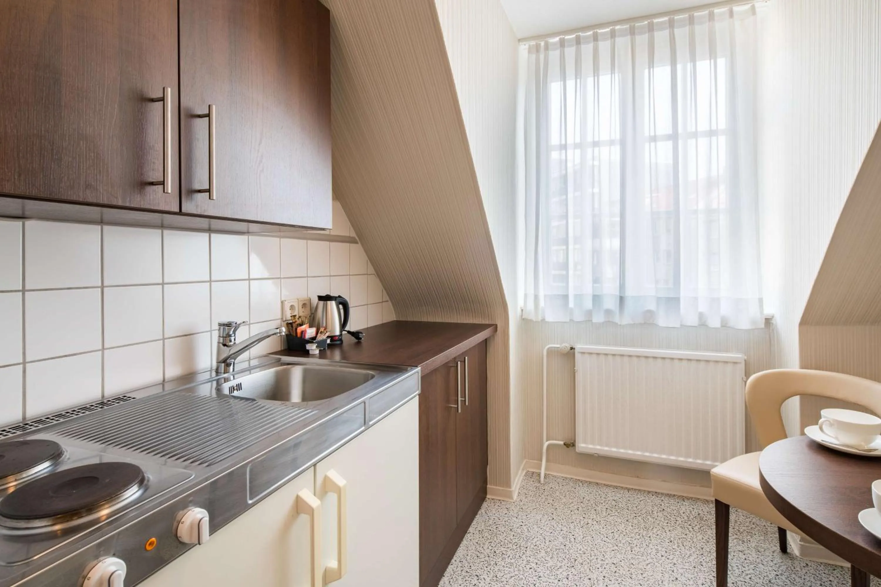 Kitchen or kitchenette in Best Western Plus Hotel StadtPalais