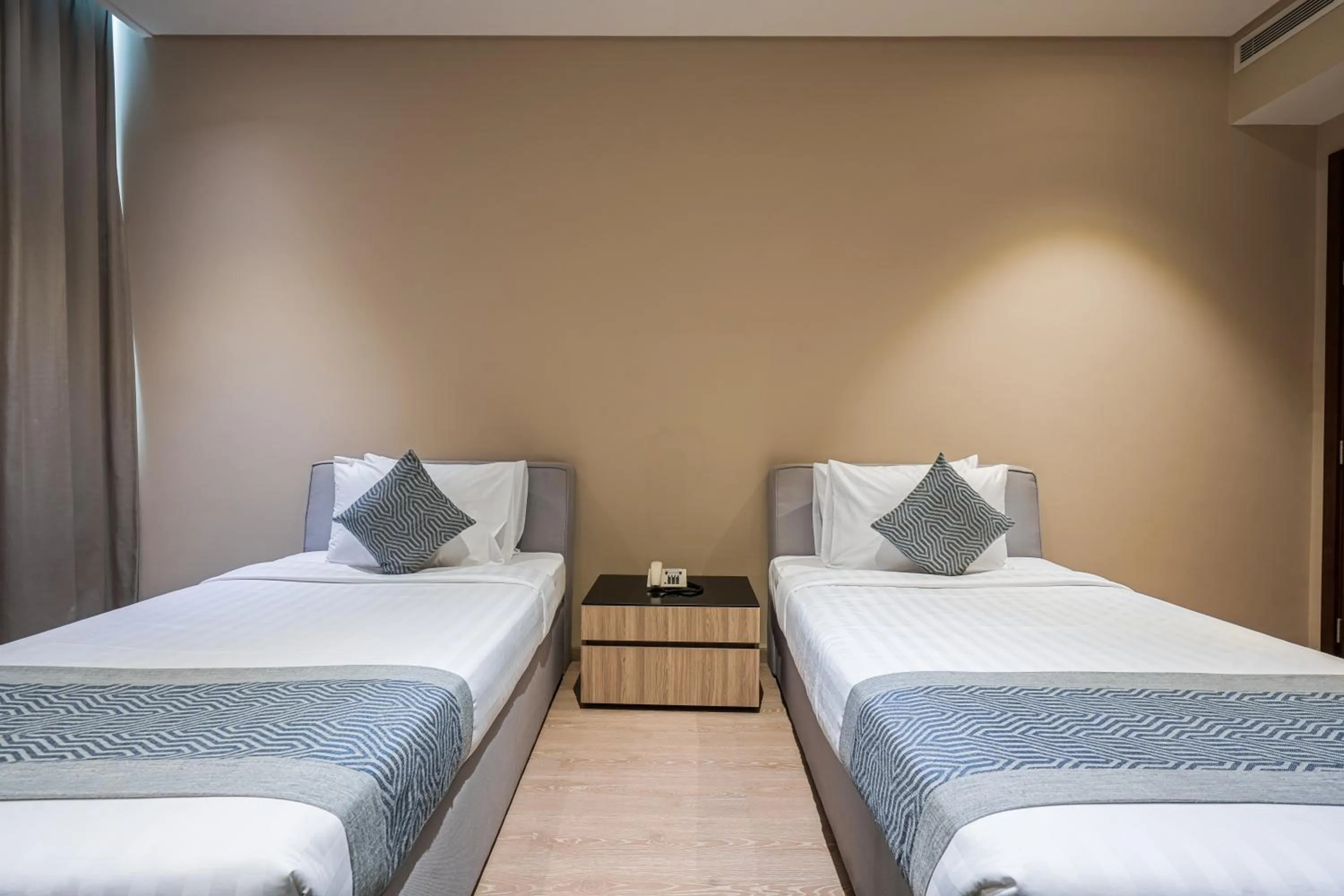 Bed in Eden Garden Hotel Apartment