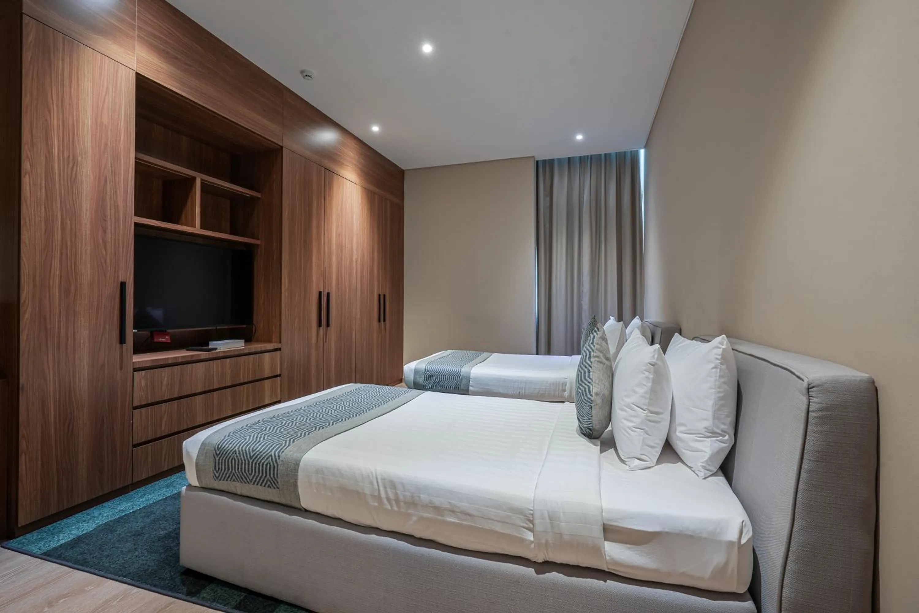 Bed in Eden Garden Hotel Apartment
