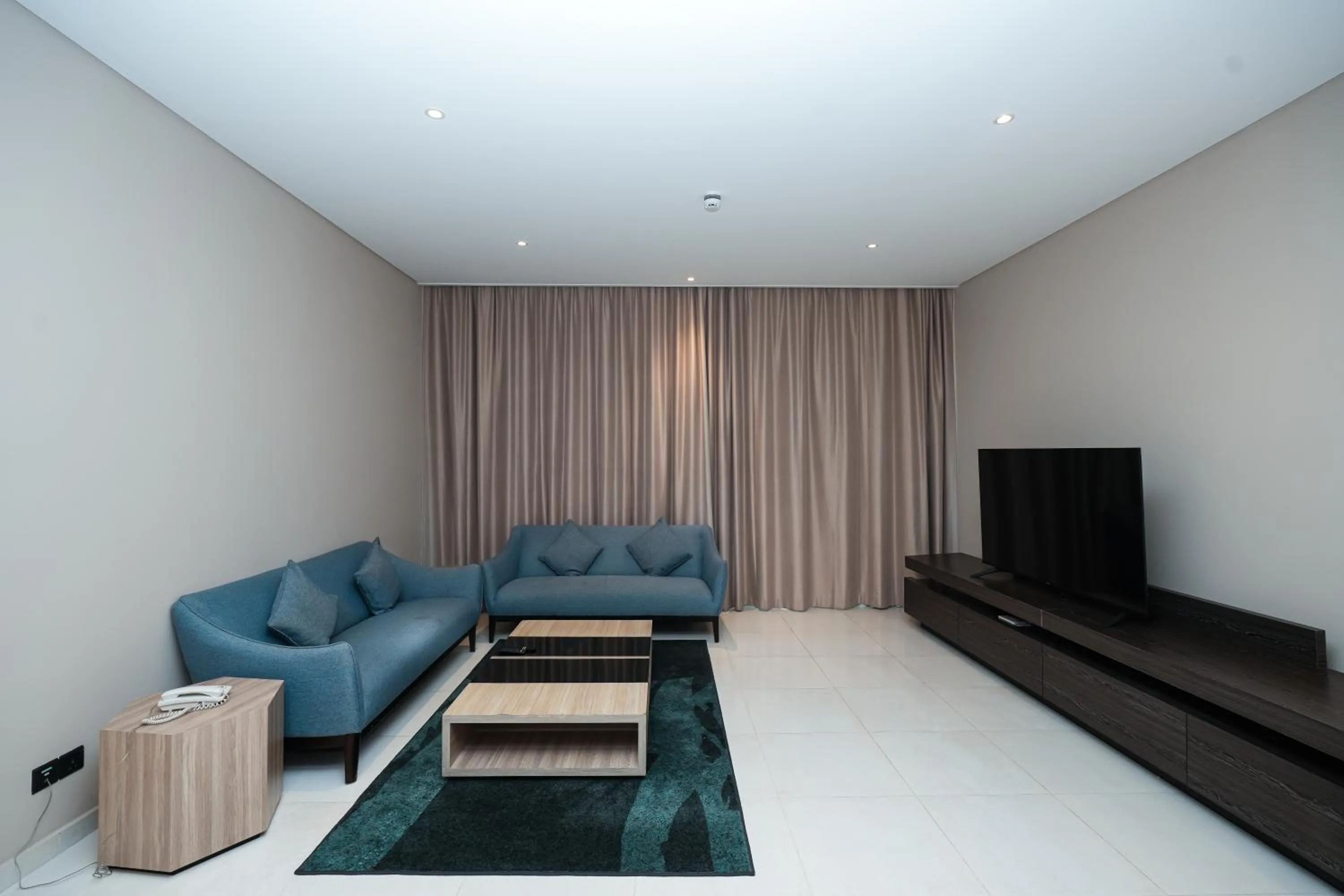 Communal lounge/ TV room in Eden Garden Hotel Apartment