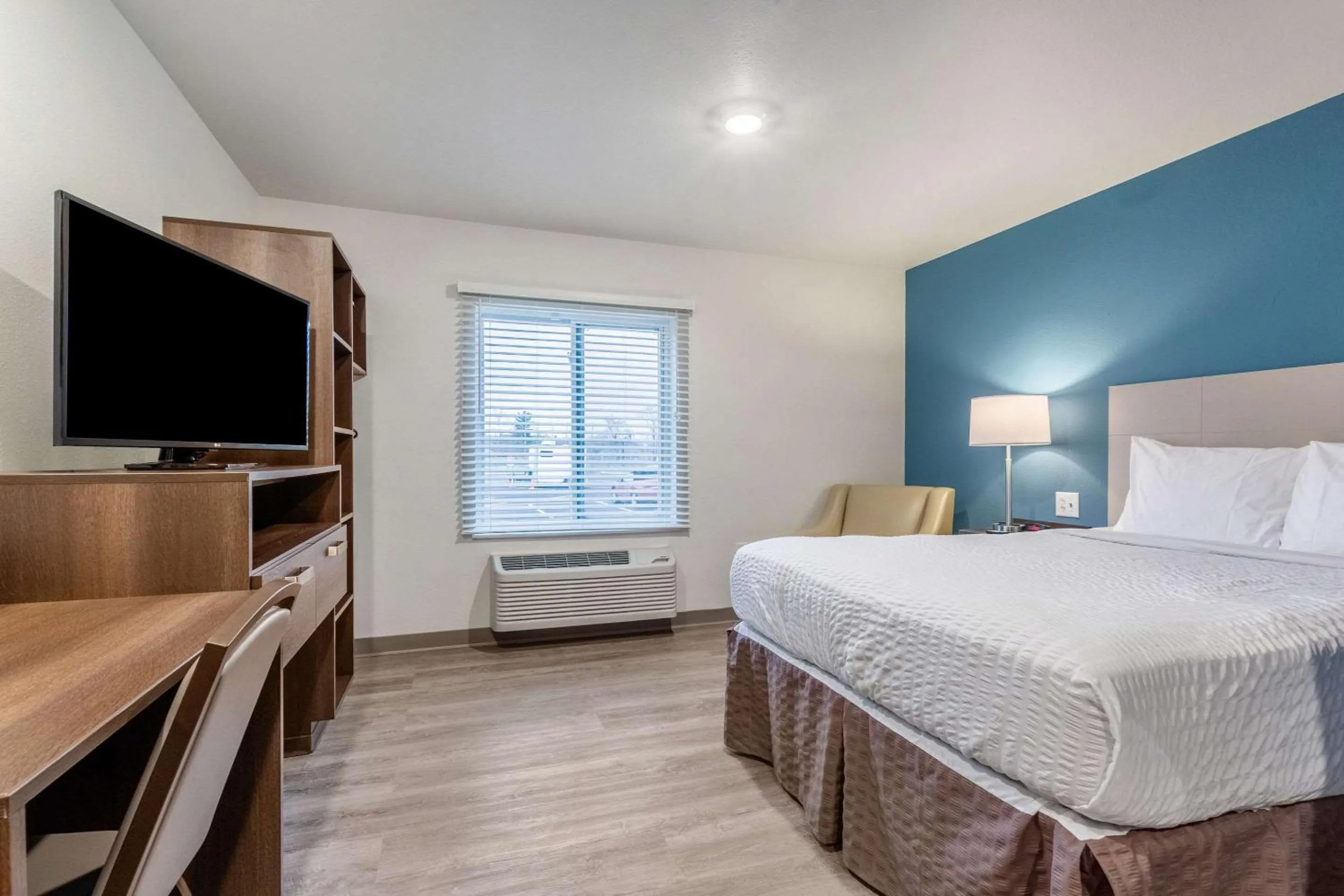 Photo of the whole room, Bed in WoodSpring Suites Indianapolis Castleton