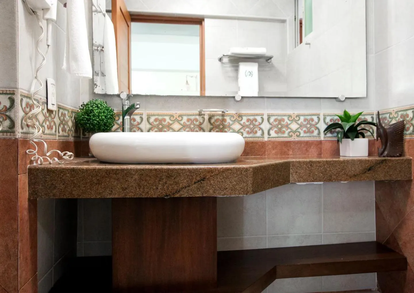 Bathroom in Marina Suites by Andiani Travel