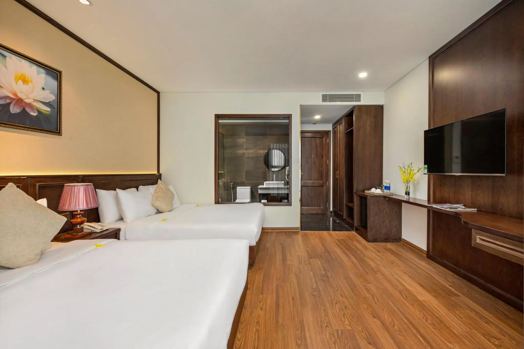 Bed in Golden Lotus Hotel Da Nang - Rooftop Bar Sea View