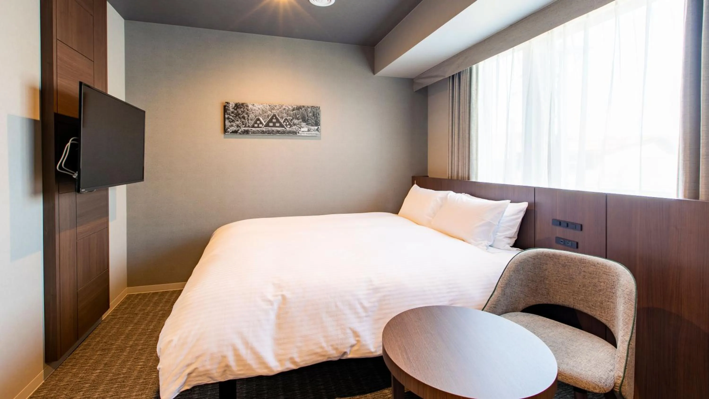 Photo of the whole room, Bed in KOKO HOTEL Hidatakayama - formaly Hotel Wing Hida Takayama