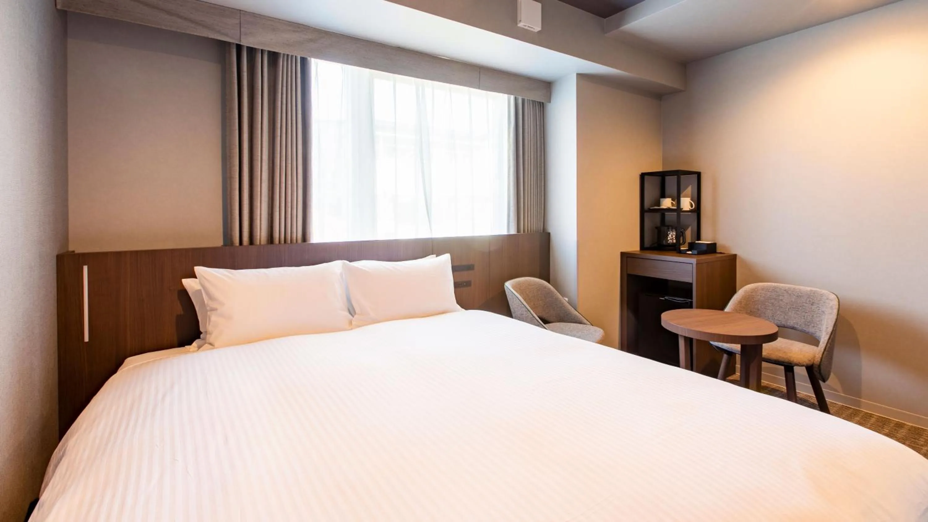 Photo of the whole room, Bed in KOKO HOTEL Hidatakayama - formaly Hotel Wing Hida Takayama