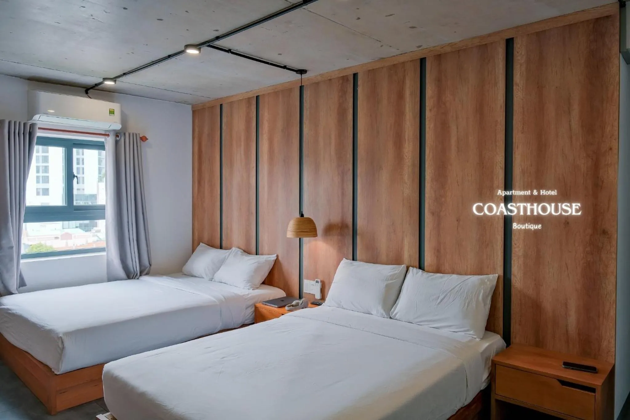 Bed in Coast House Boutique Hotel