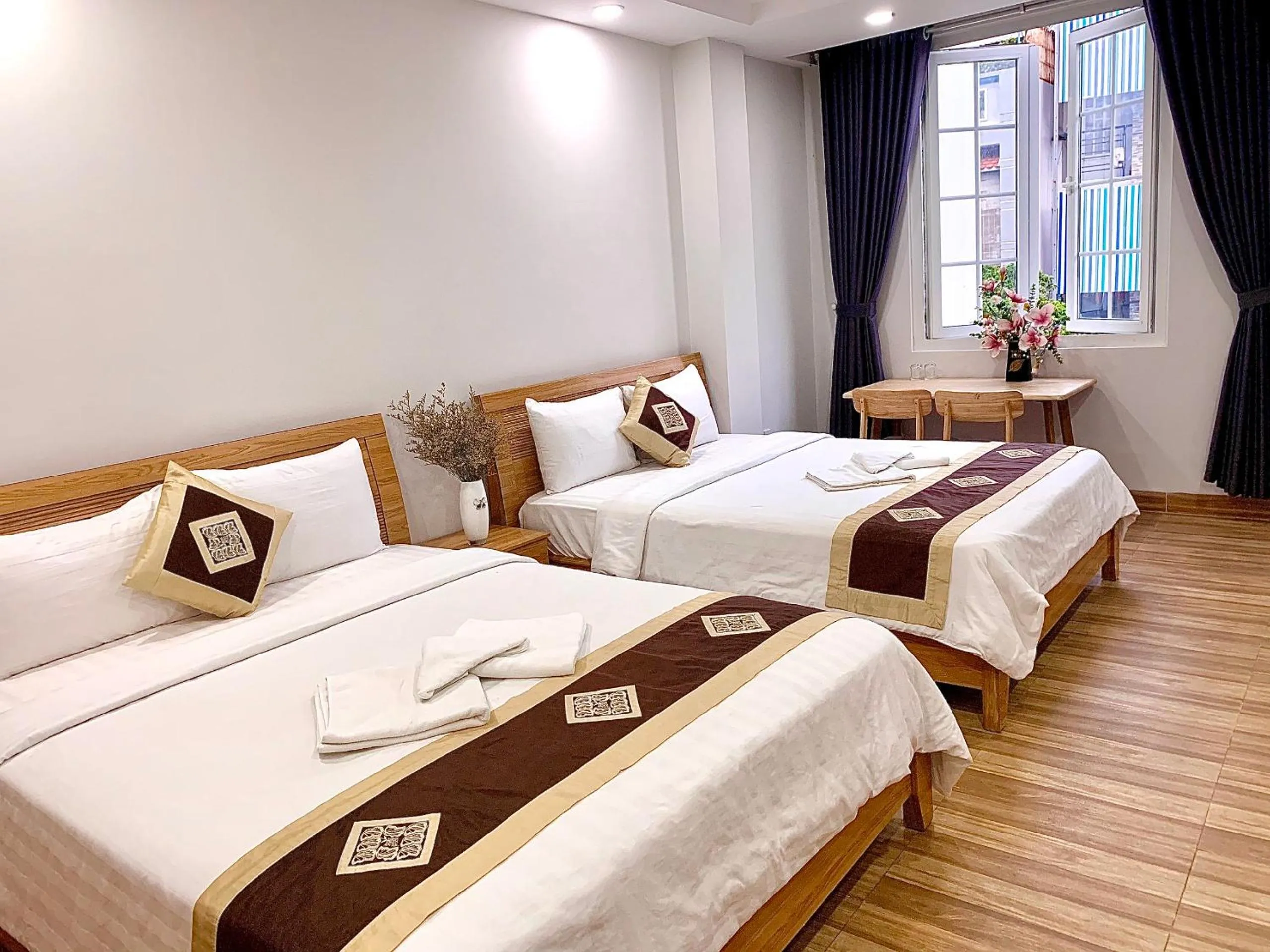 Photo of the whole room, Bed in The Lumiere near Tan Son Nhat Airport