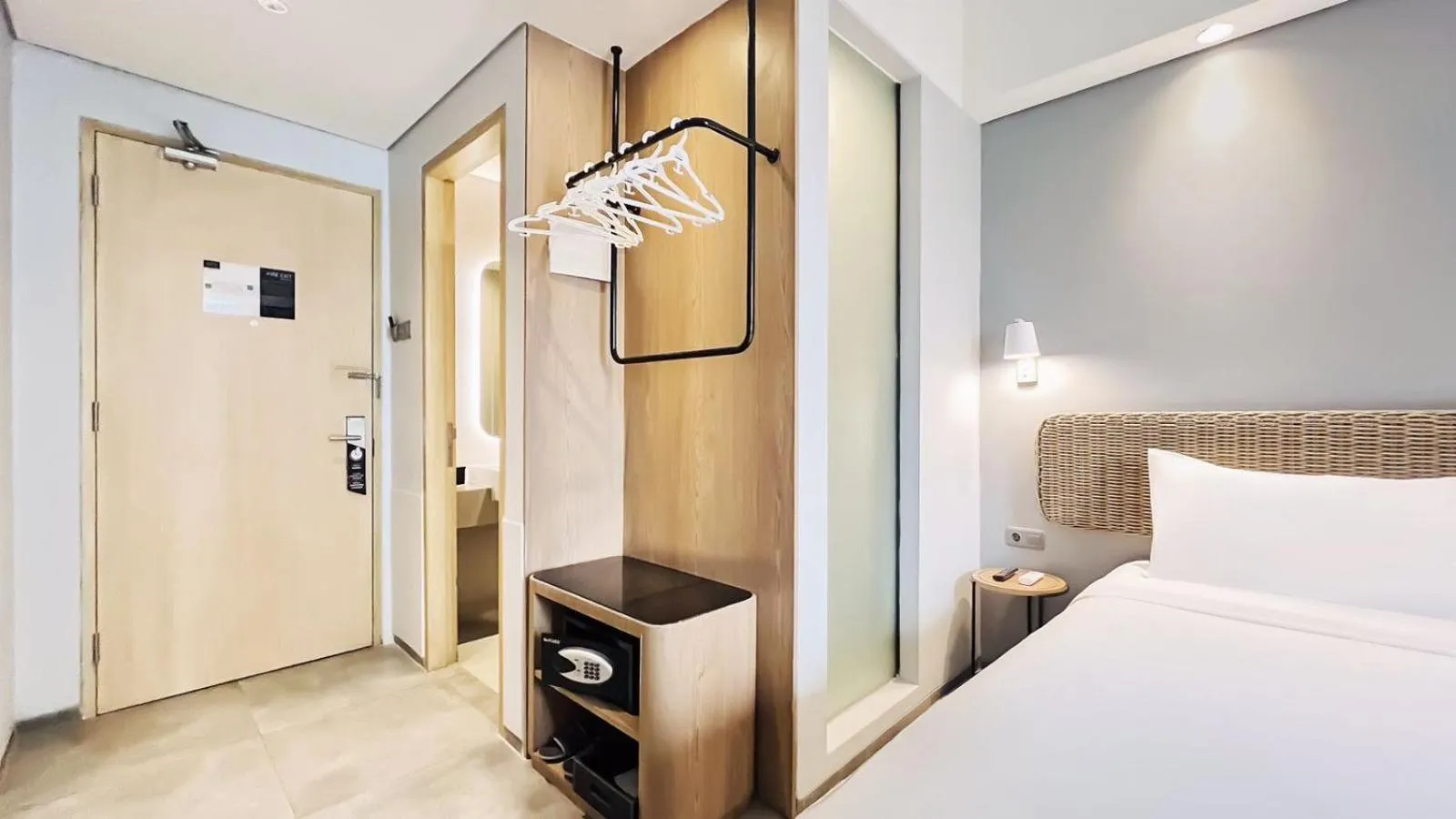 wardrobe, Bed in Neo Hotel Puri Indah