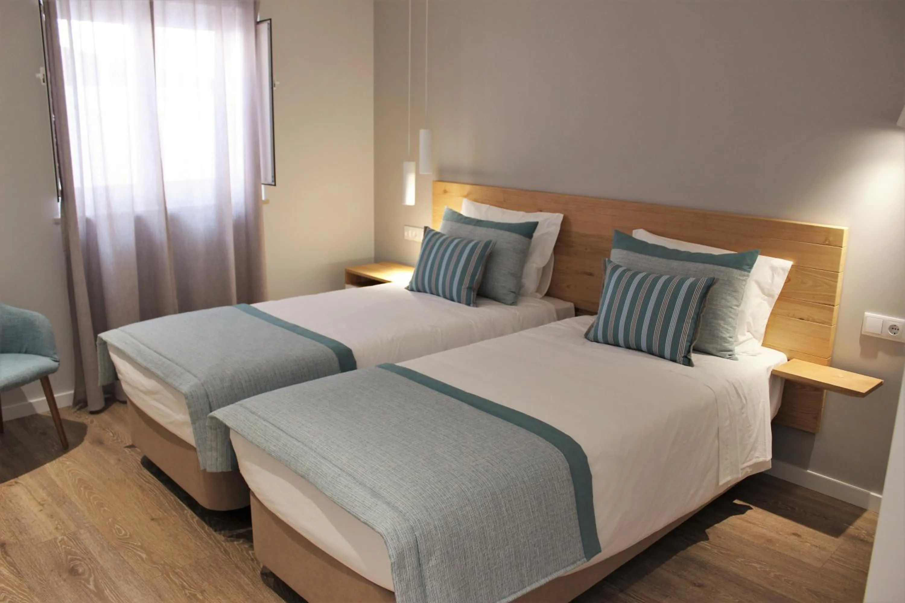 Bed in Cardeal Suites & Apartments