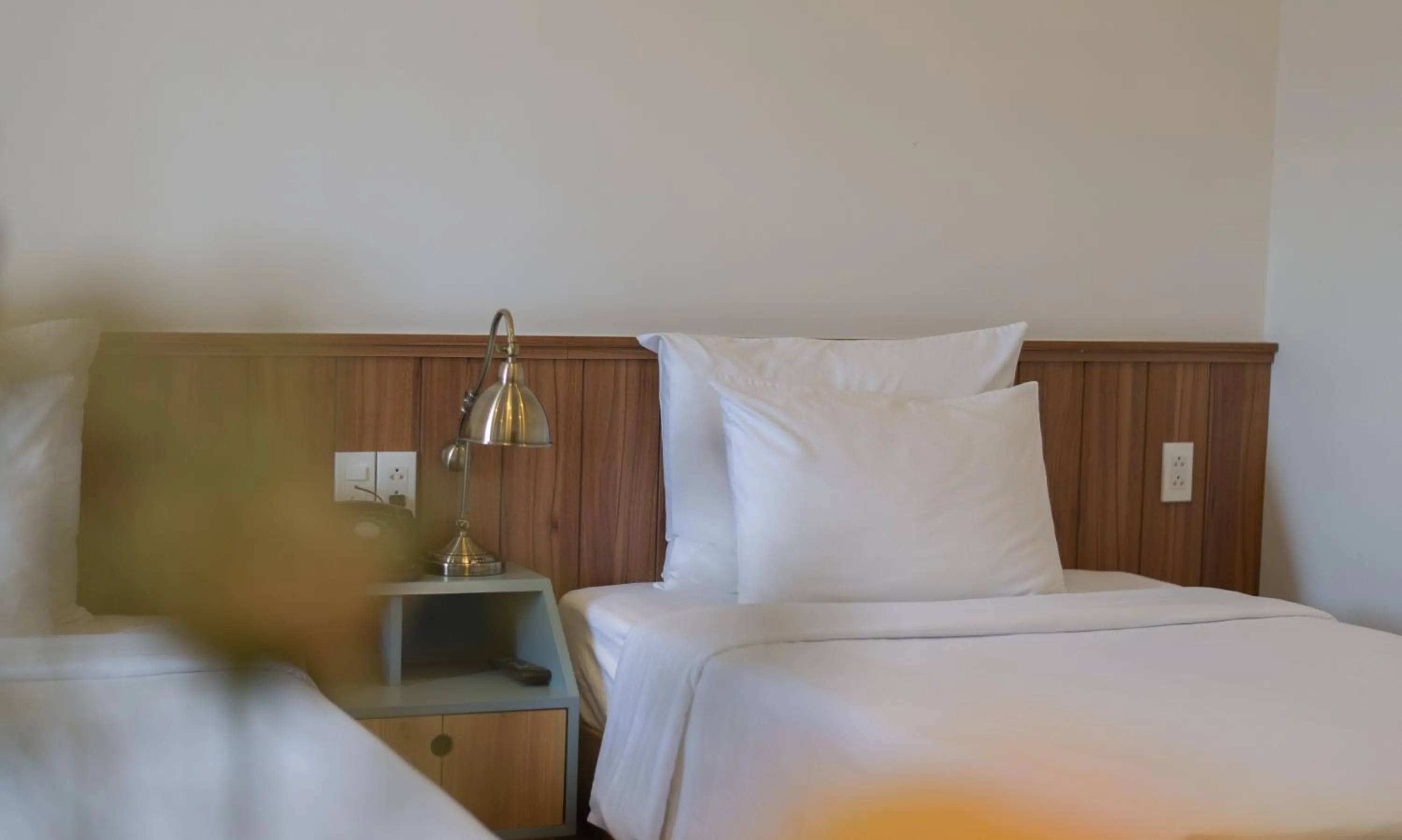 Bed in Le Soleil Boutique Hotel