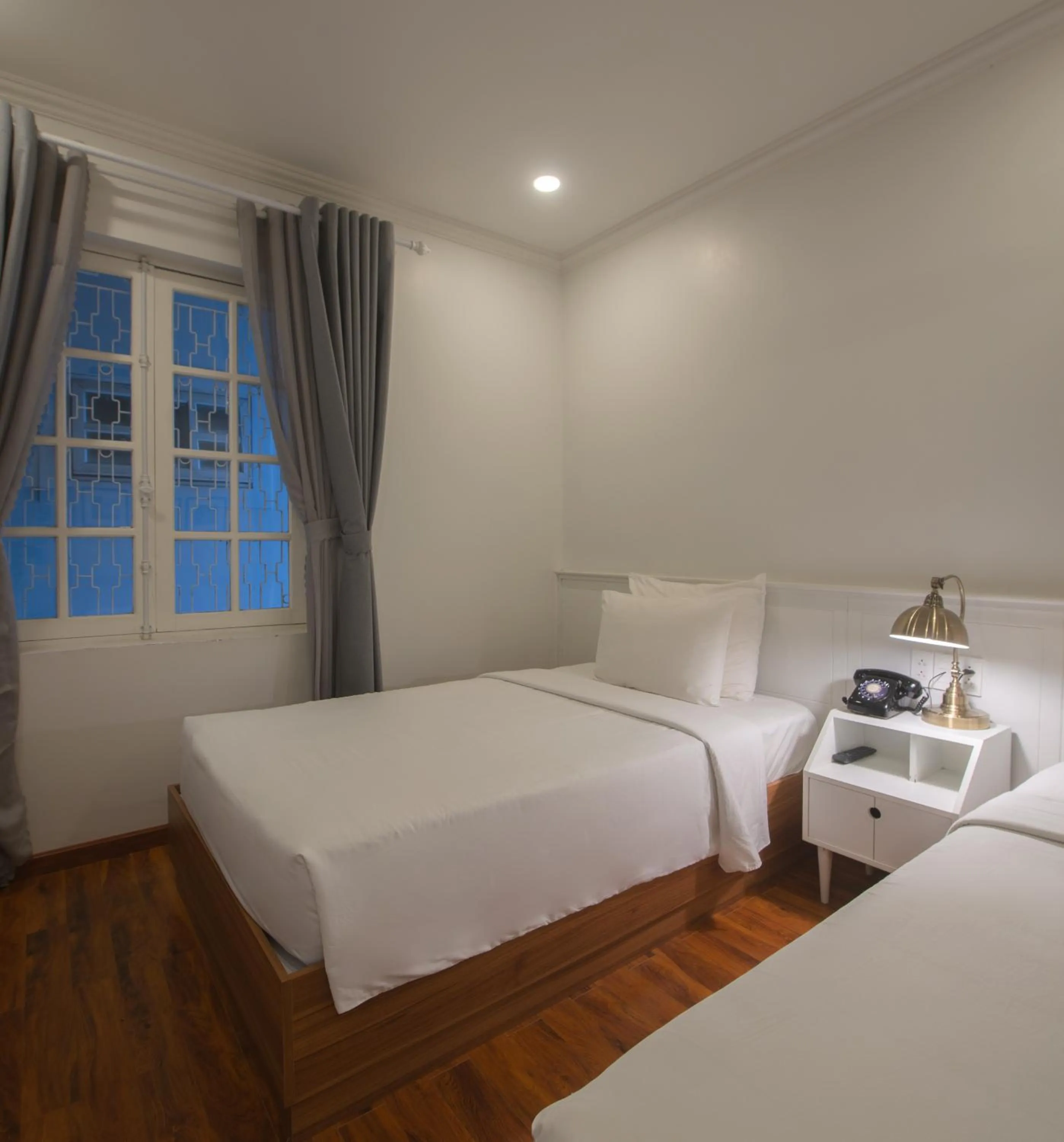 Bed in Le Soleil Boutique Hotel