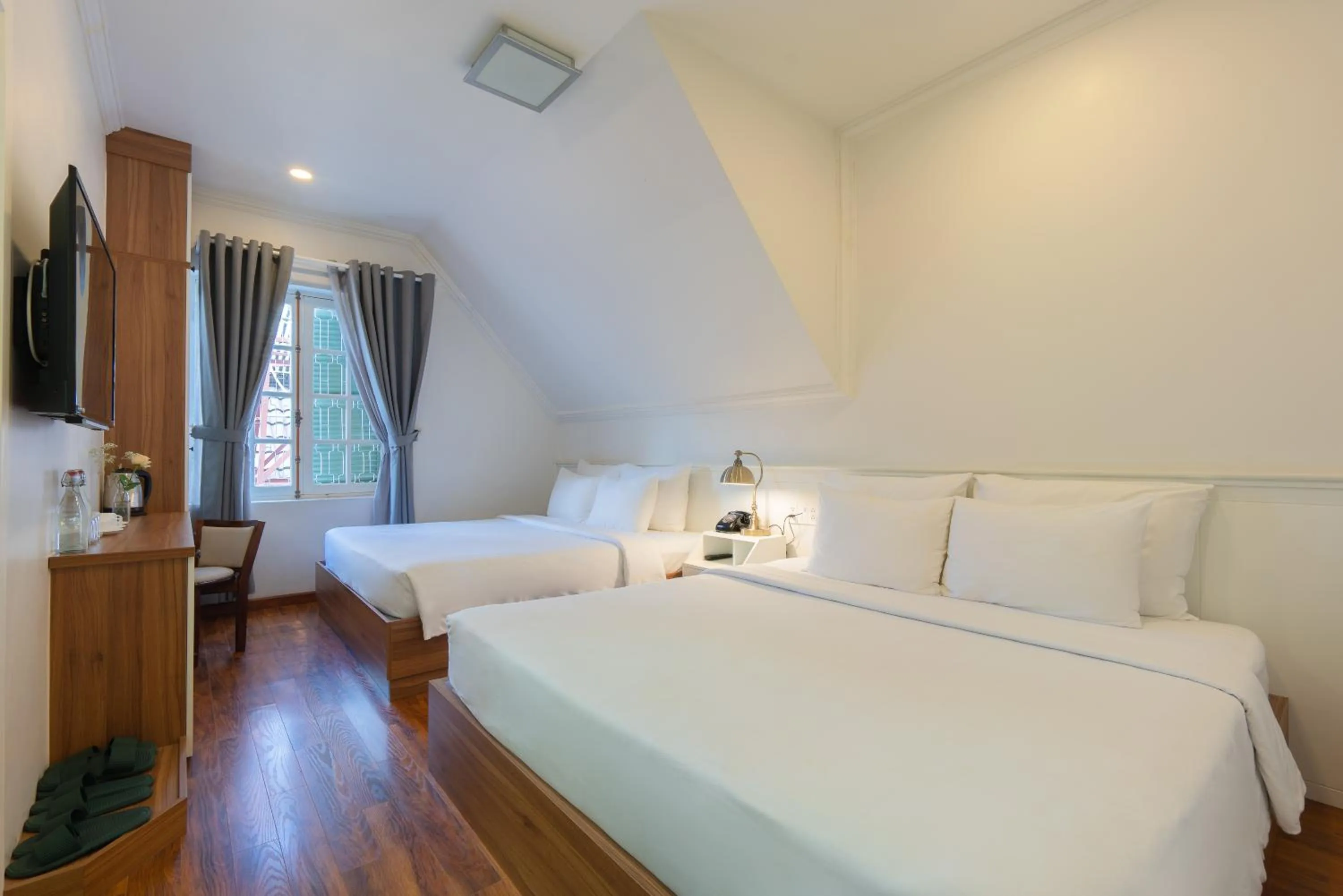 Bed in Le Soleil Boutique Hotel