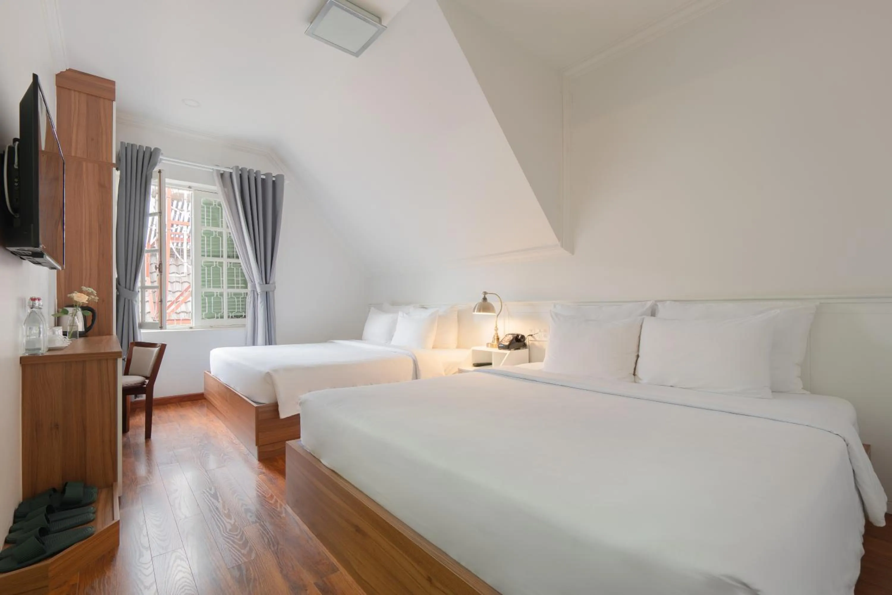 Bed in Le Soleil Boutique Hotel