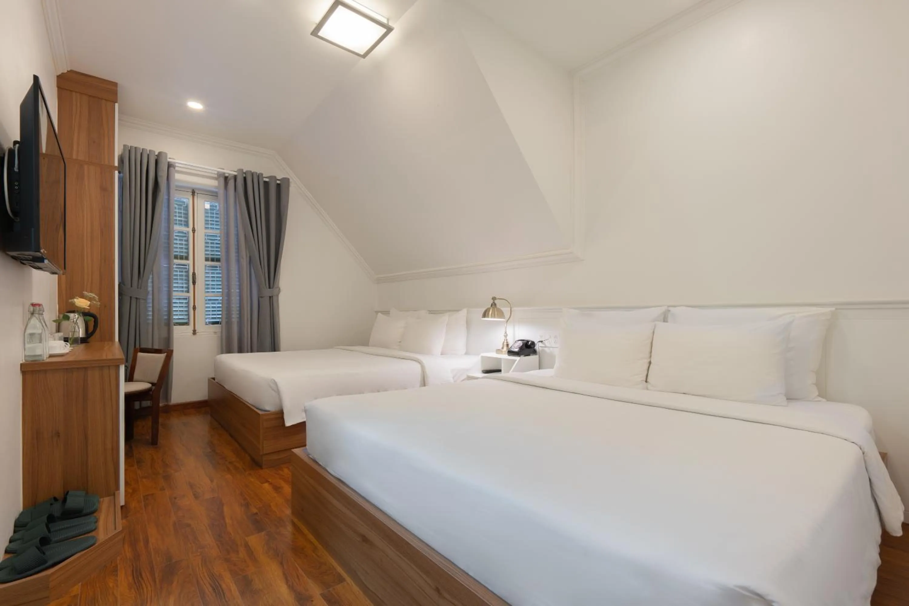 Bed in Le Soleil Boutique Hotel