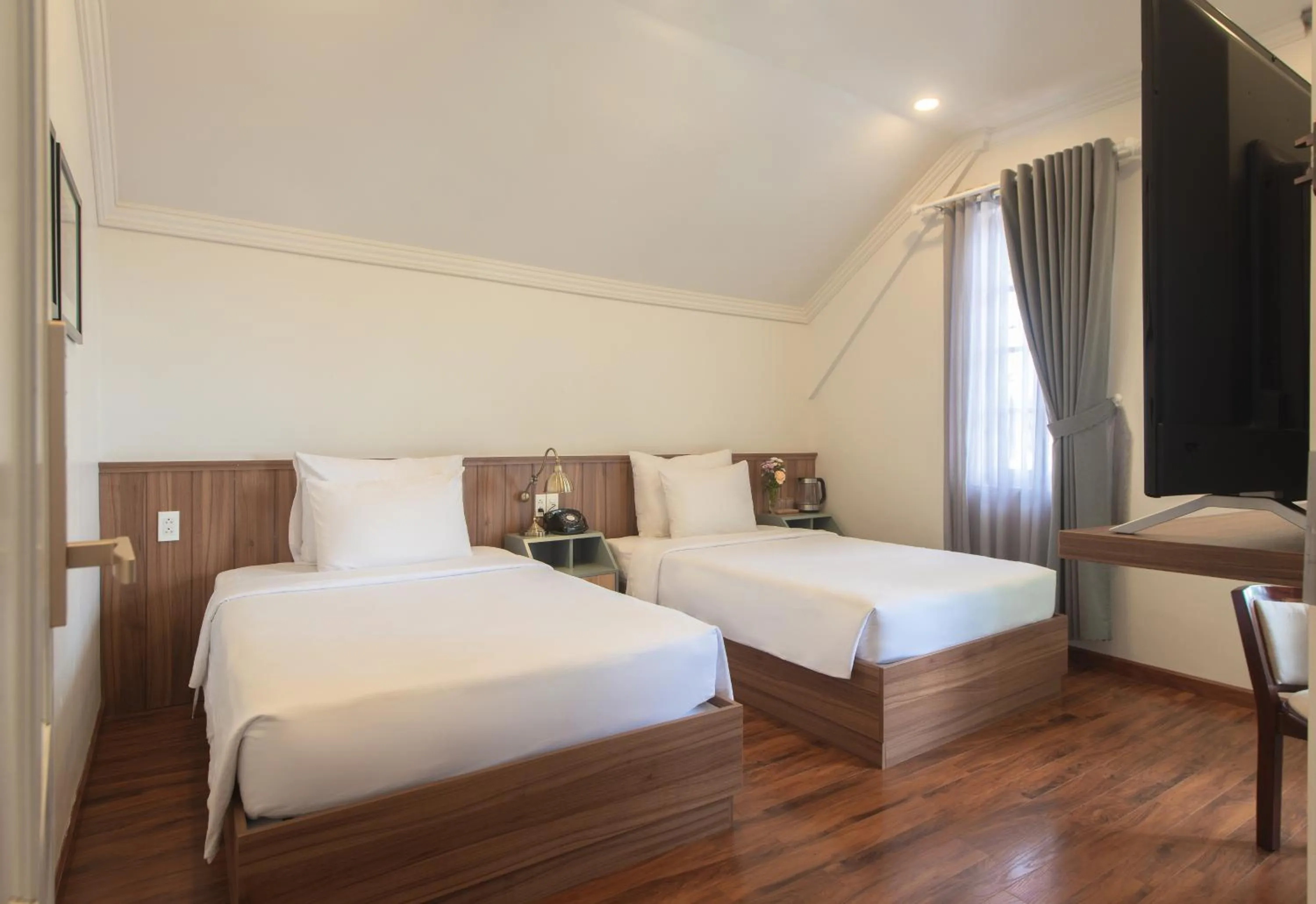 Bed in Le Soleil Boutique Hotel