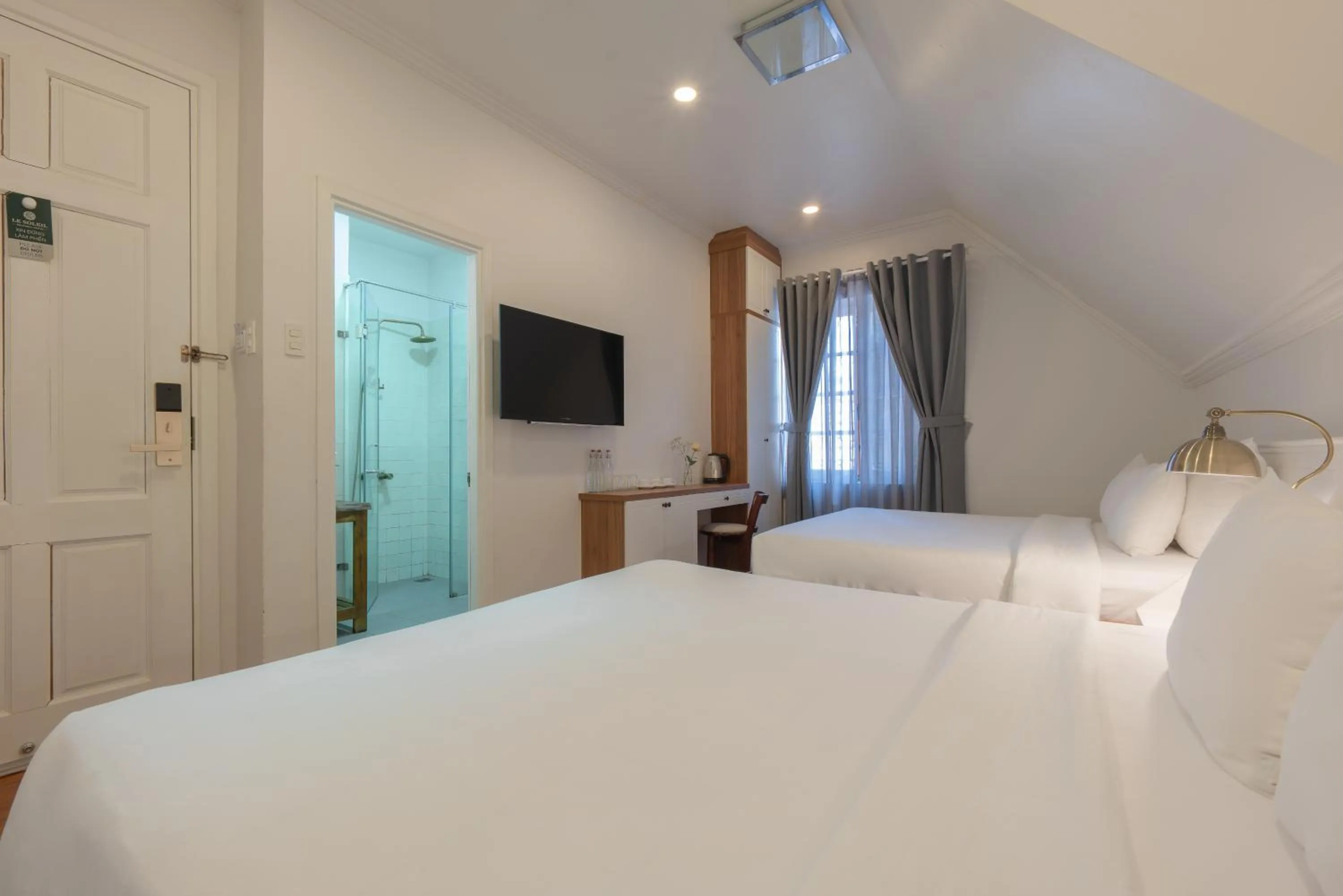 Bed in Le Soleil Boutique Hotel