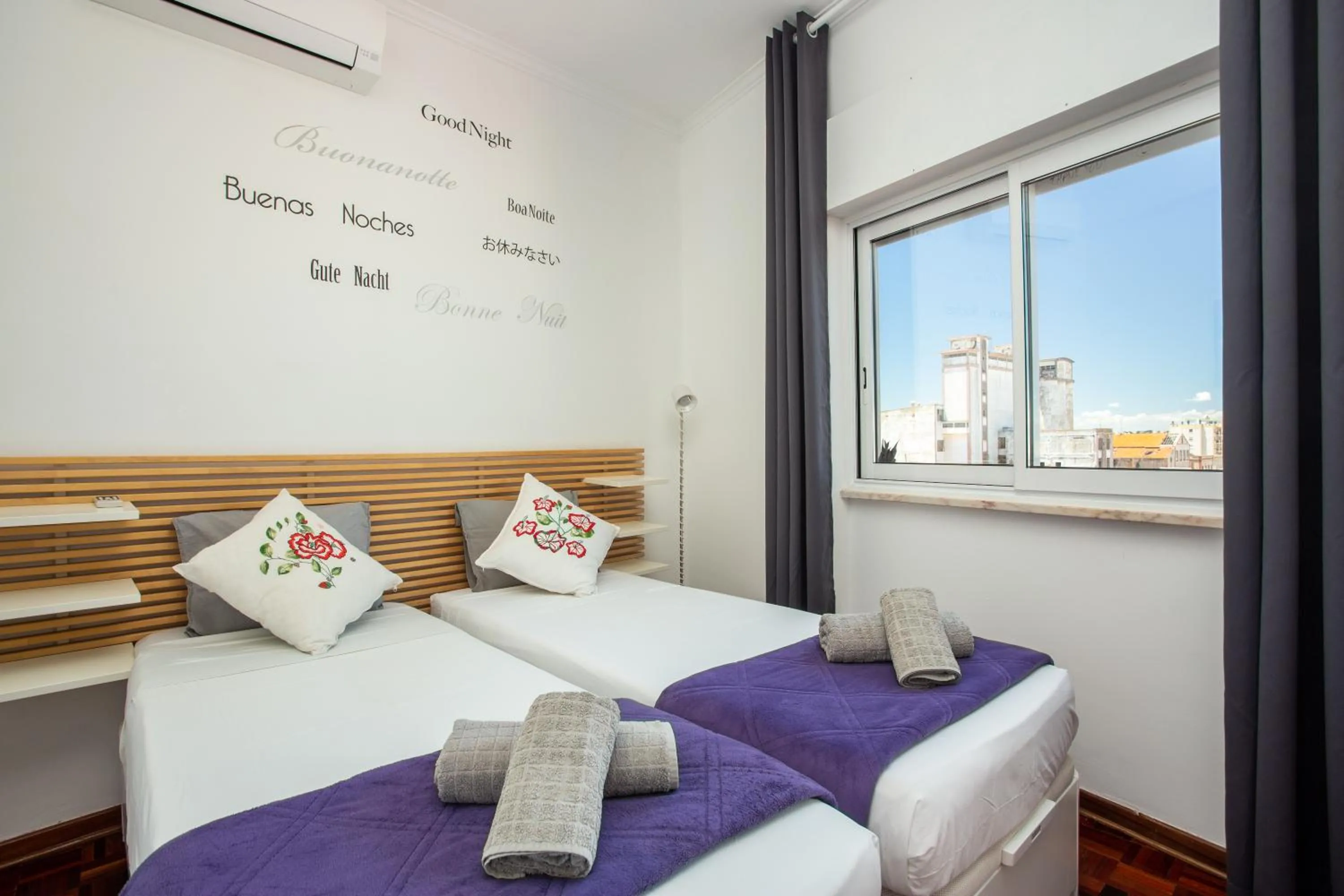 Bed in Dreamers Duplex with Seaview