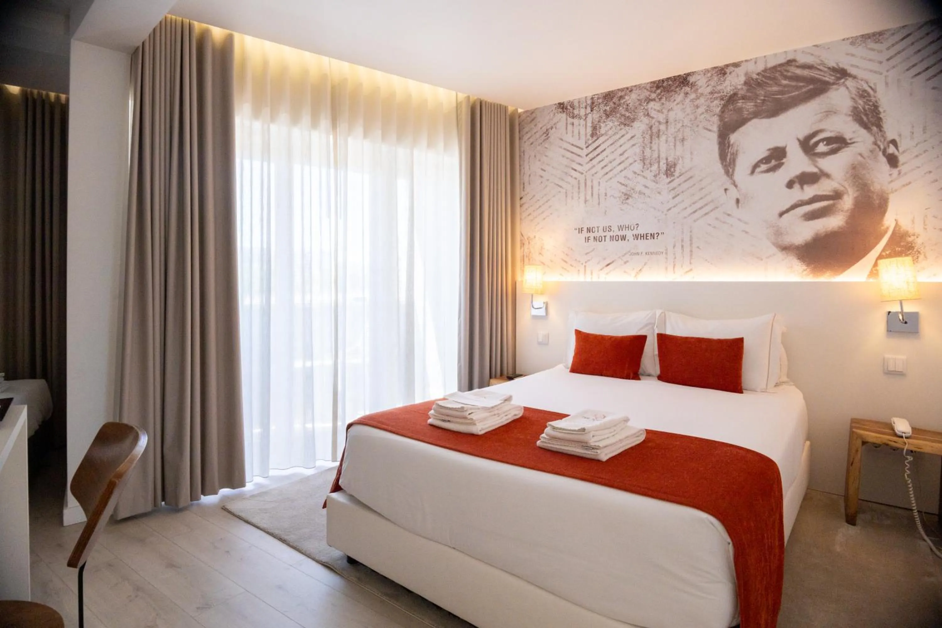 Bed in The ICONS Lisbon Hotel