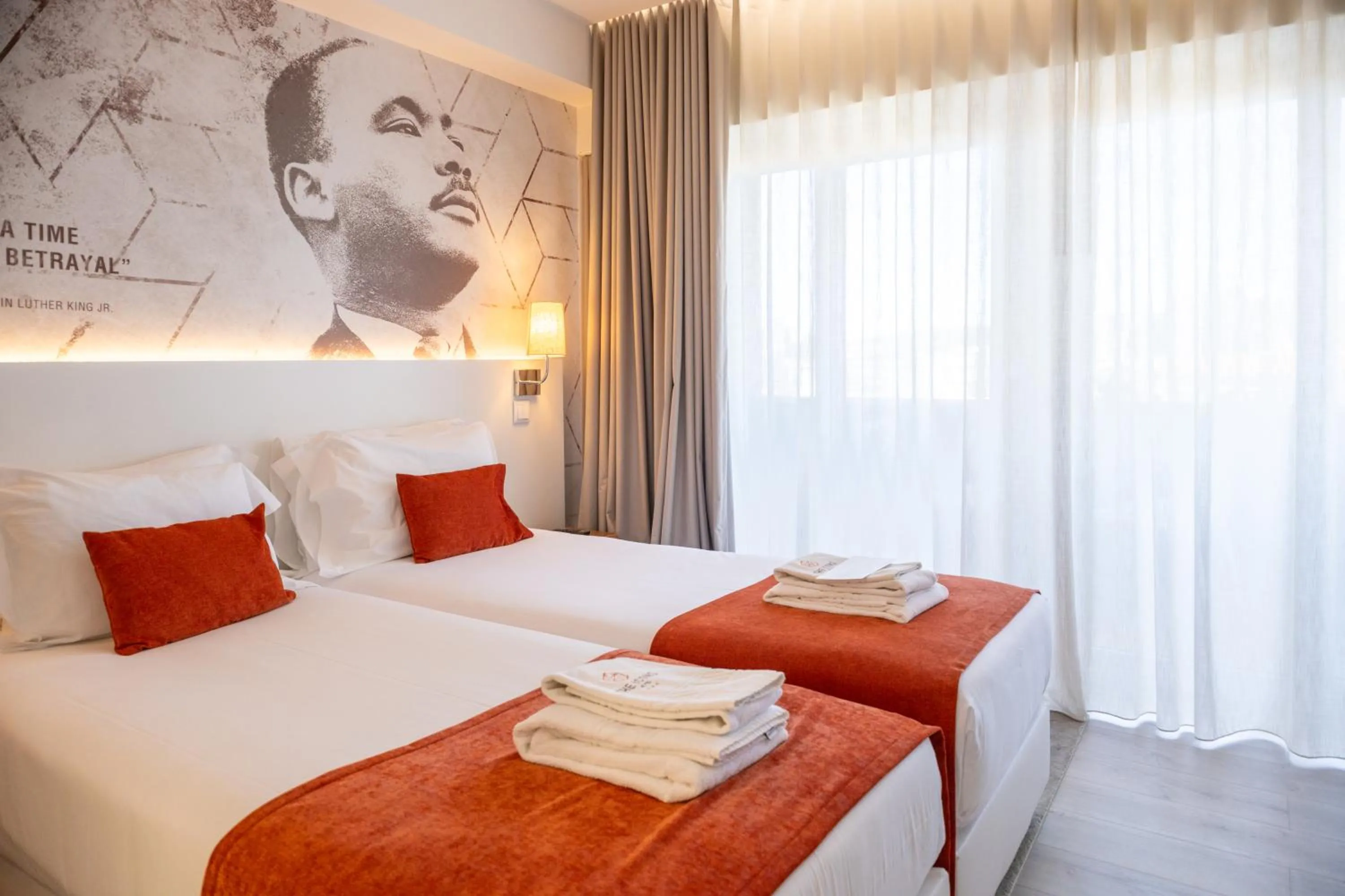 Bed in The ICONS Lisbon Hotel