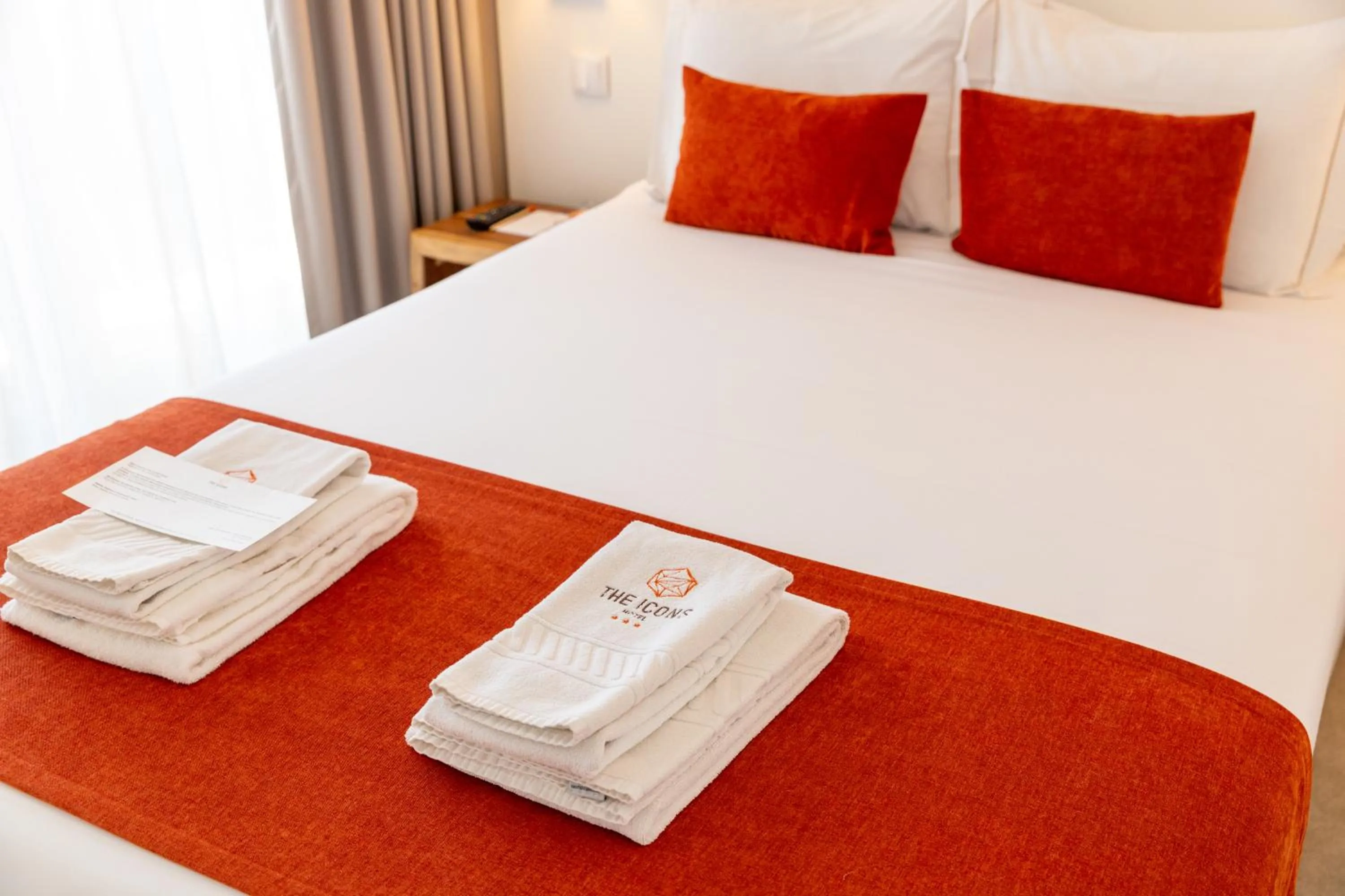 Bed in The ICONS Lisbon Hotel