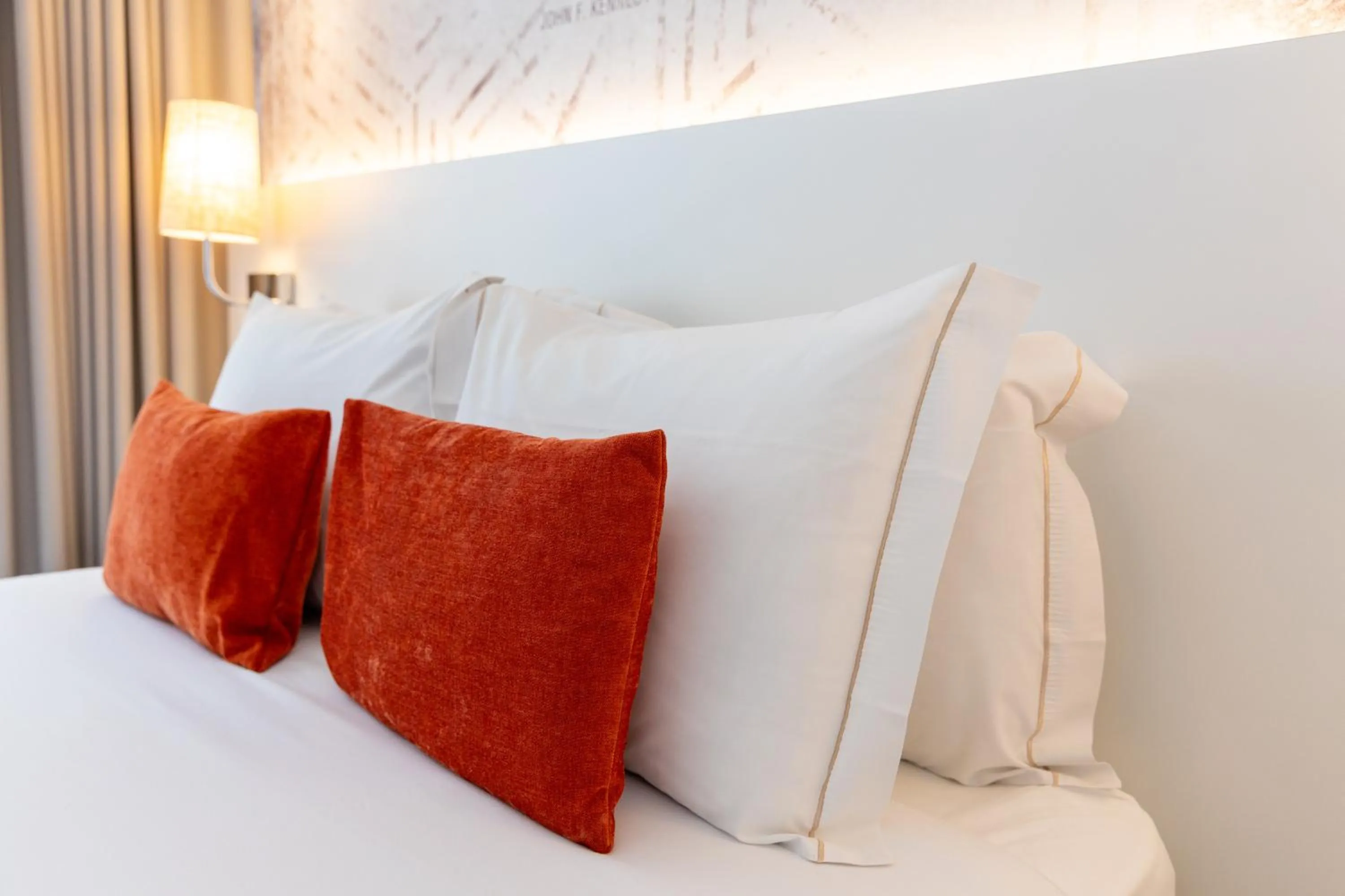 Bed in The ICONS Lisbon Hotel