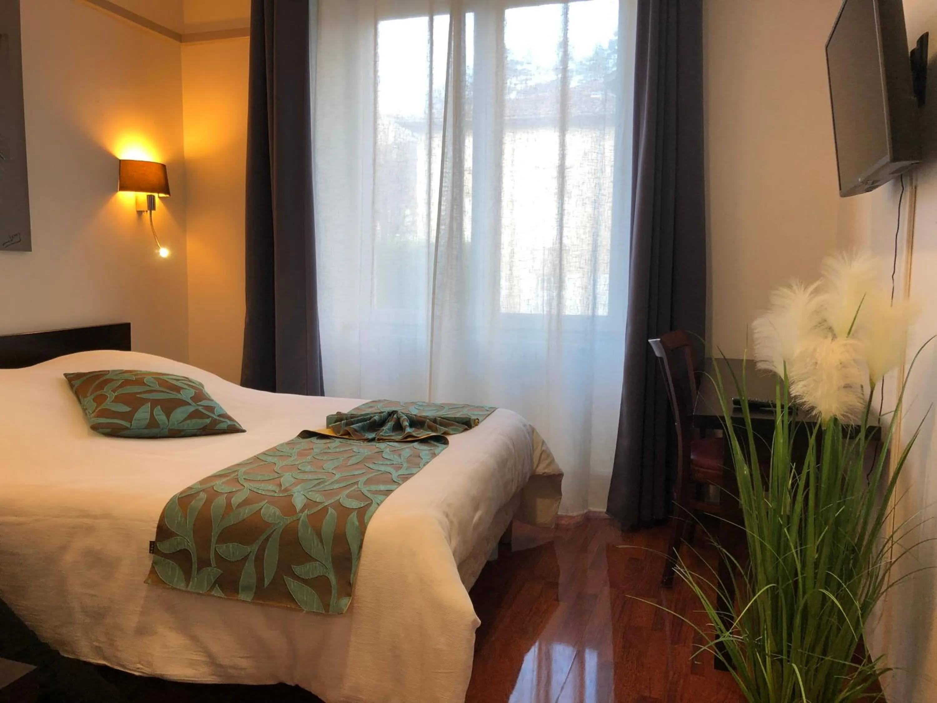 Bed in L'EMBLEME - BOUTIQUE HOTEL