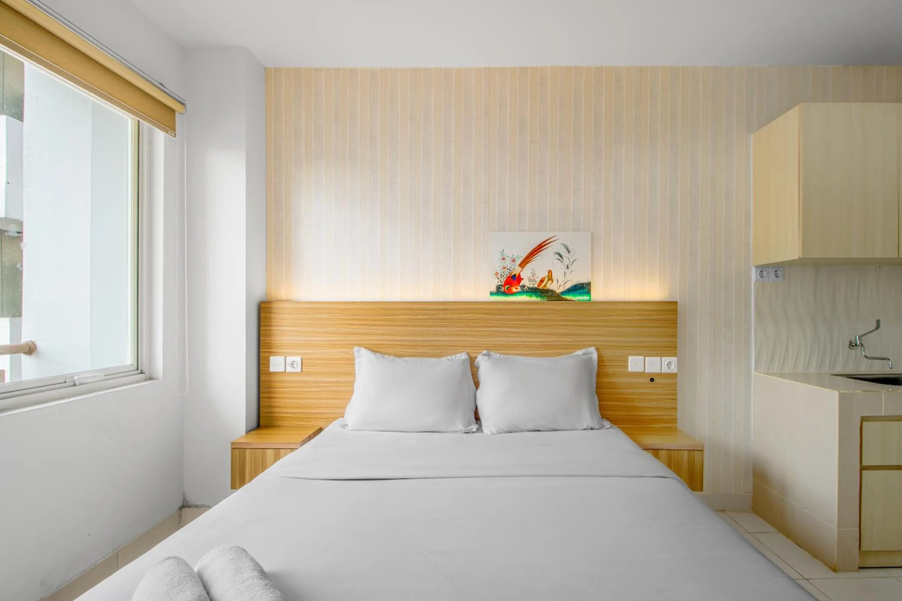 Bed in Skyland Sentul Tower Apartment