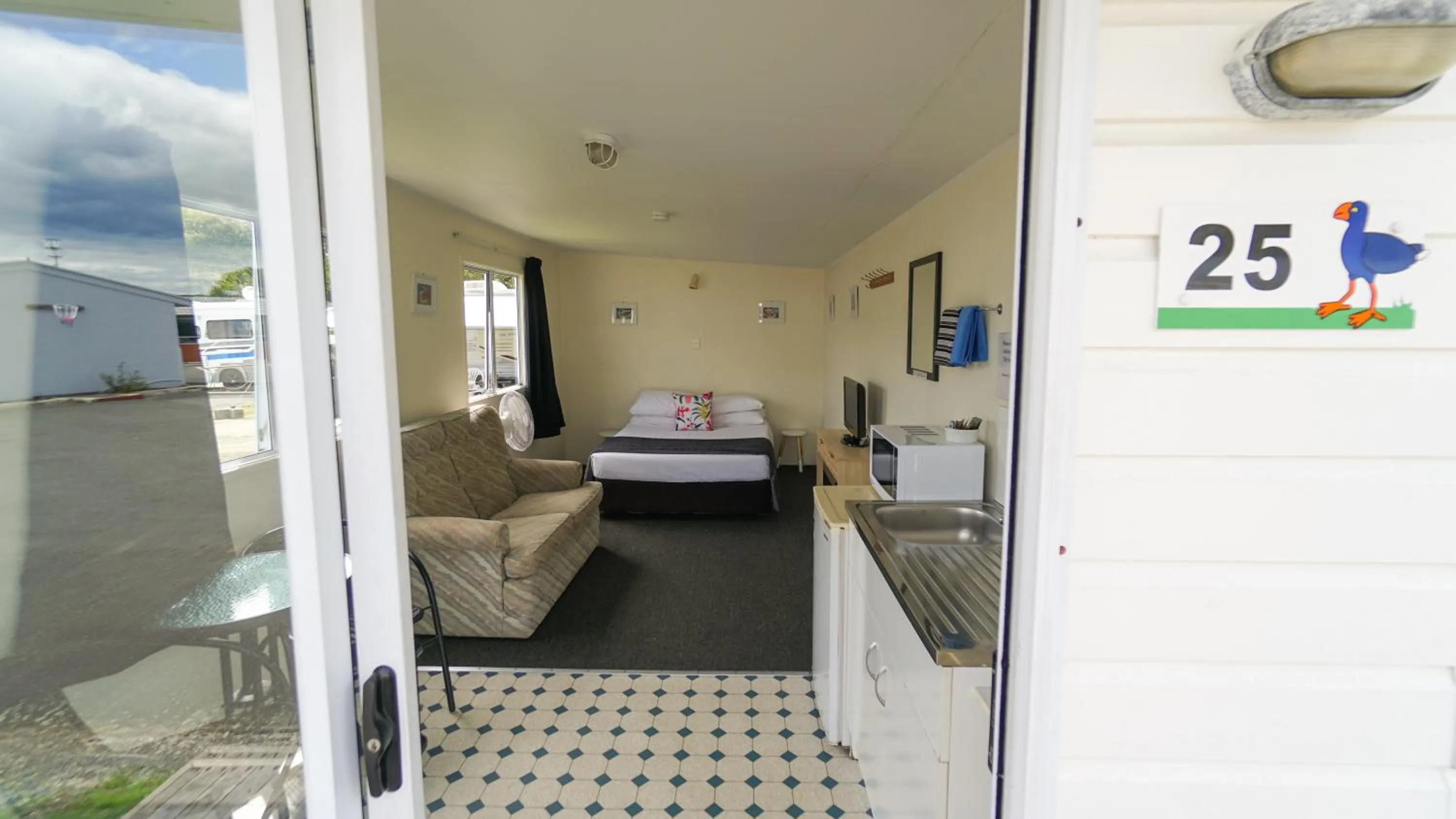 Living room, Bed in Whangarei Central Holiday Park