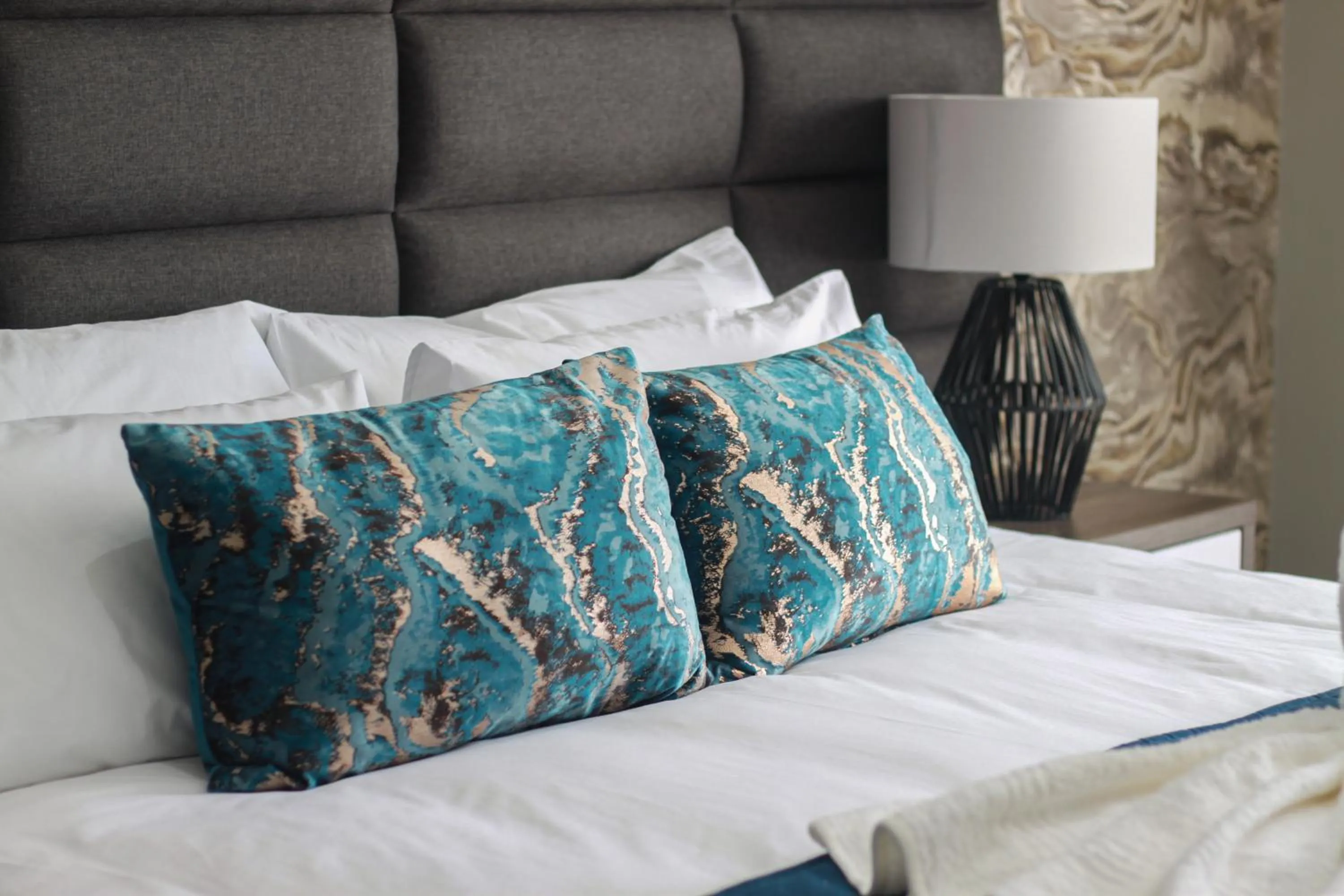 Bed in The Cato Suites Hotel