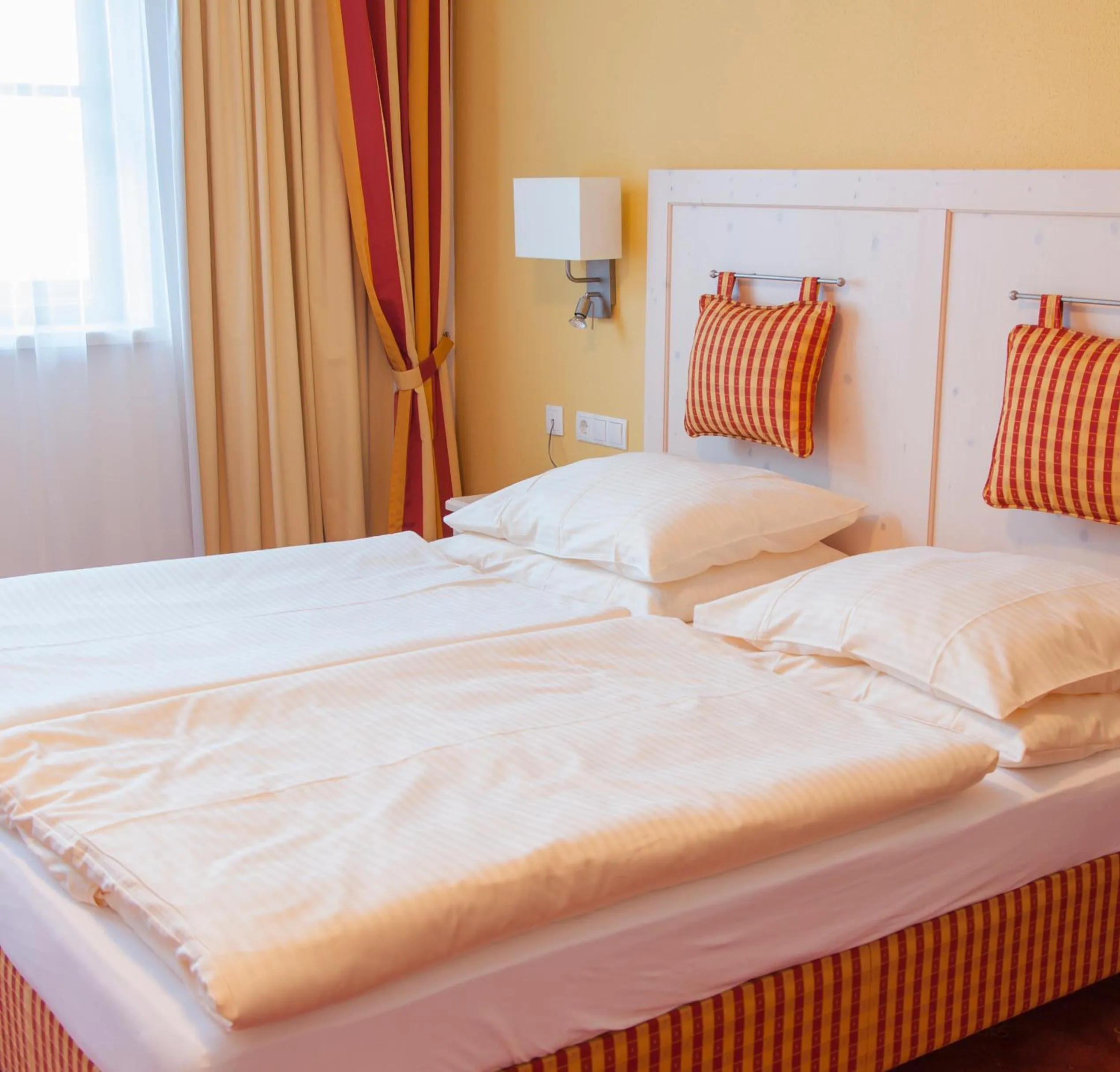 Bed in Hotel Enzian by Alpeffect Hotels