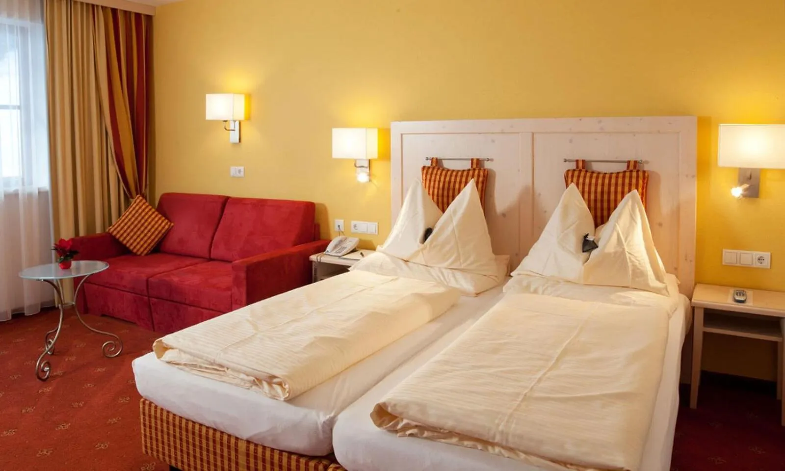 Bed in Hotel Enzian by Alpeffect Hotels