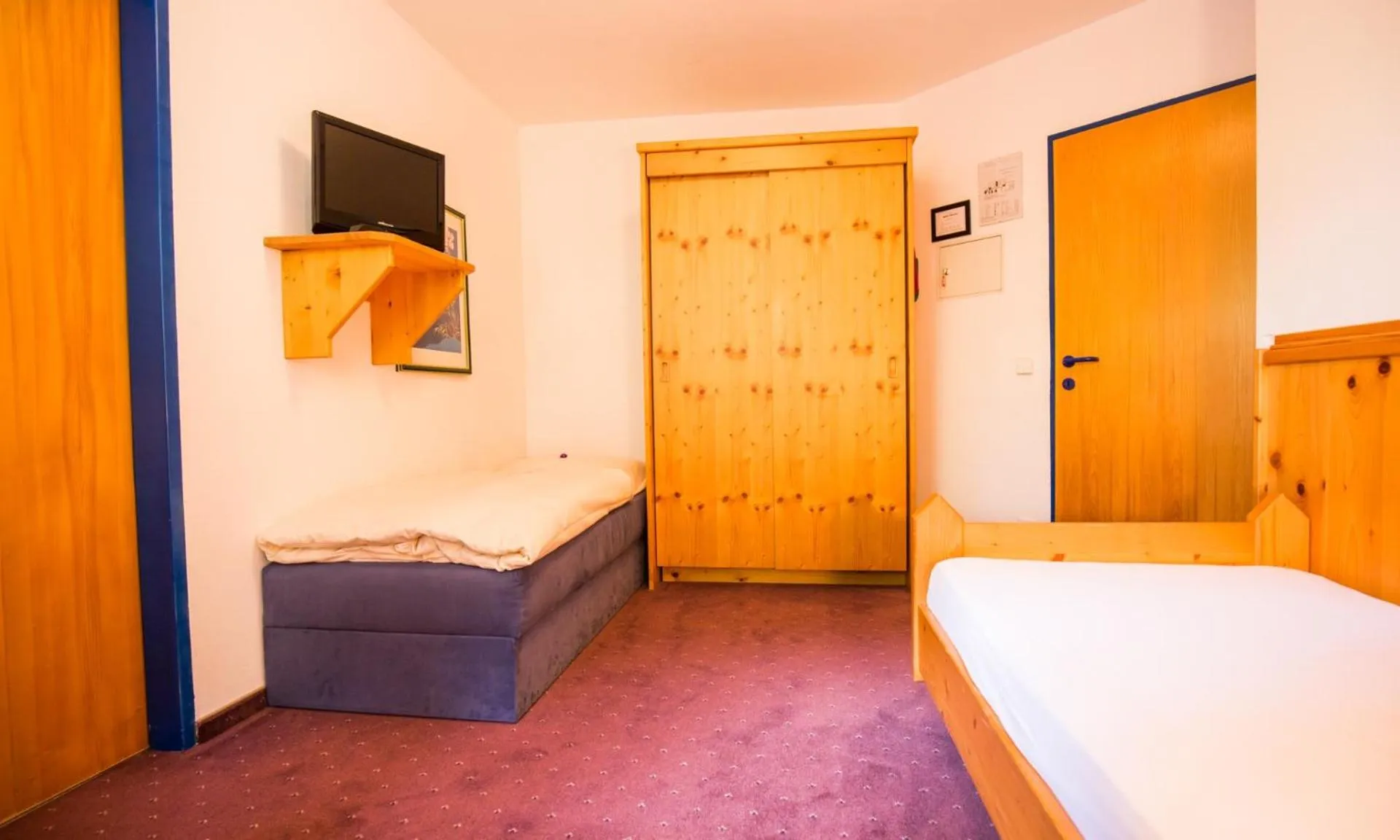 Bed in Hotel Enzian by Alpeffect Hotels