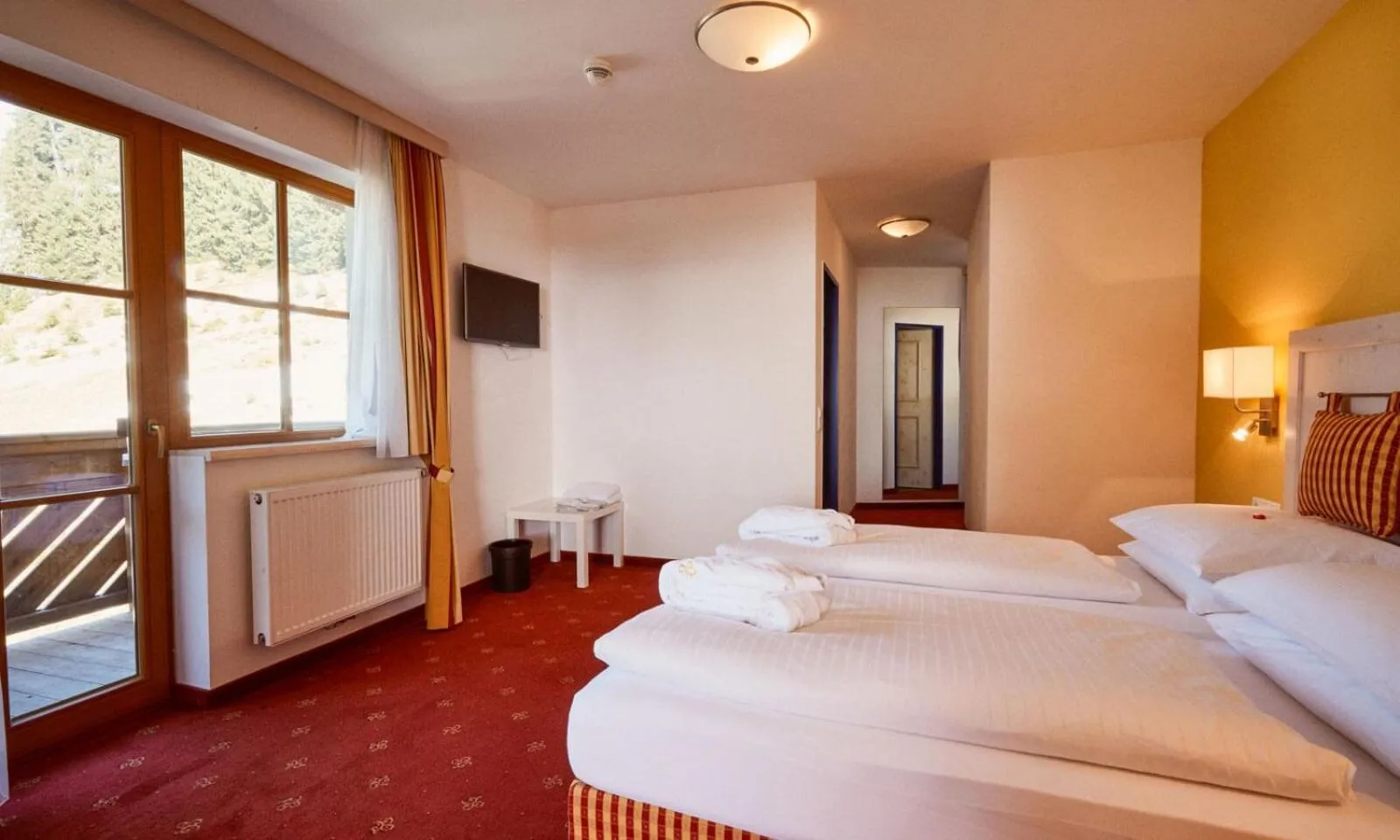 Bed in Hotel Enzian by Alpeffect Hotels