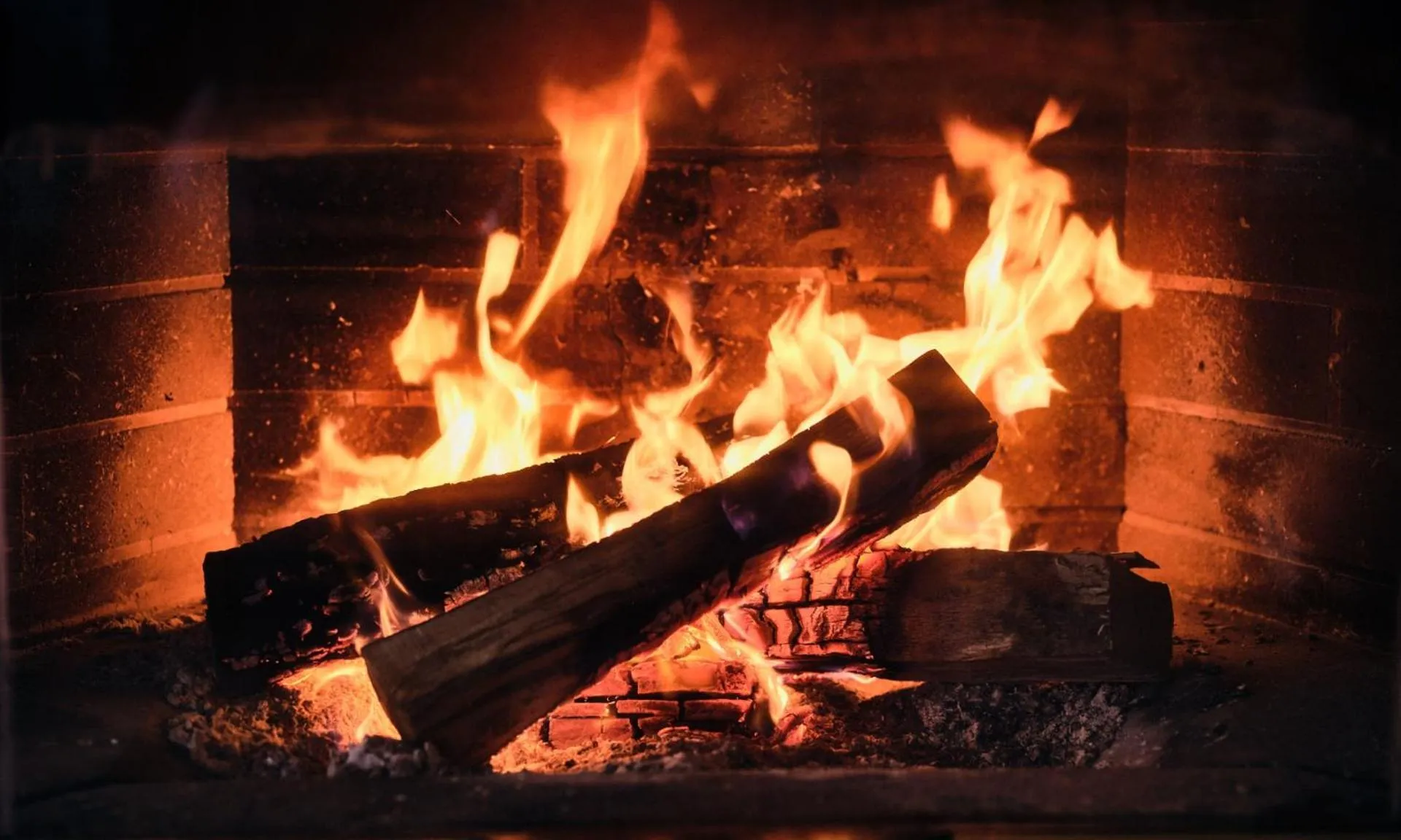 fireplace in Hotel Enzian by Alpeffect Hotels