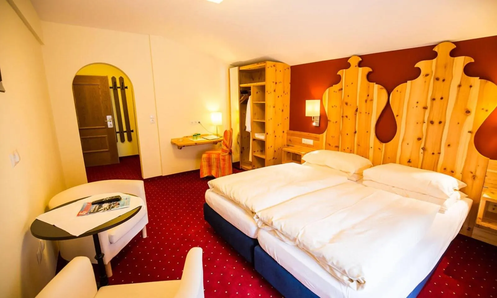 Bed in Hotel Enzian by Alpeffect Hotels