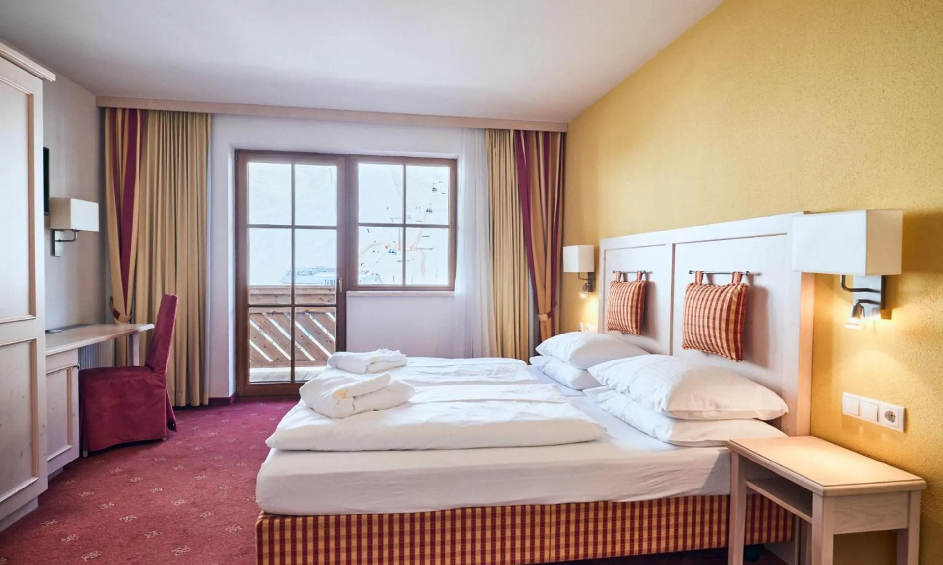 Bed in Hotel Enzian by Alpeffect Hotels