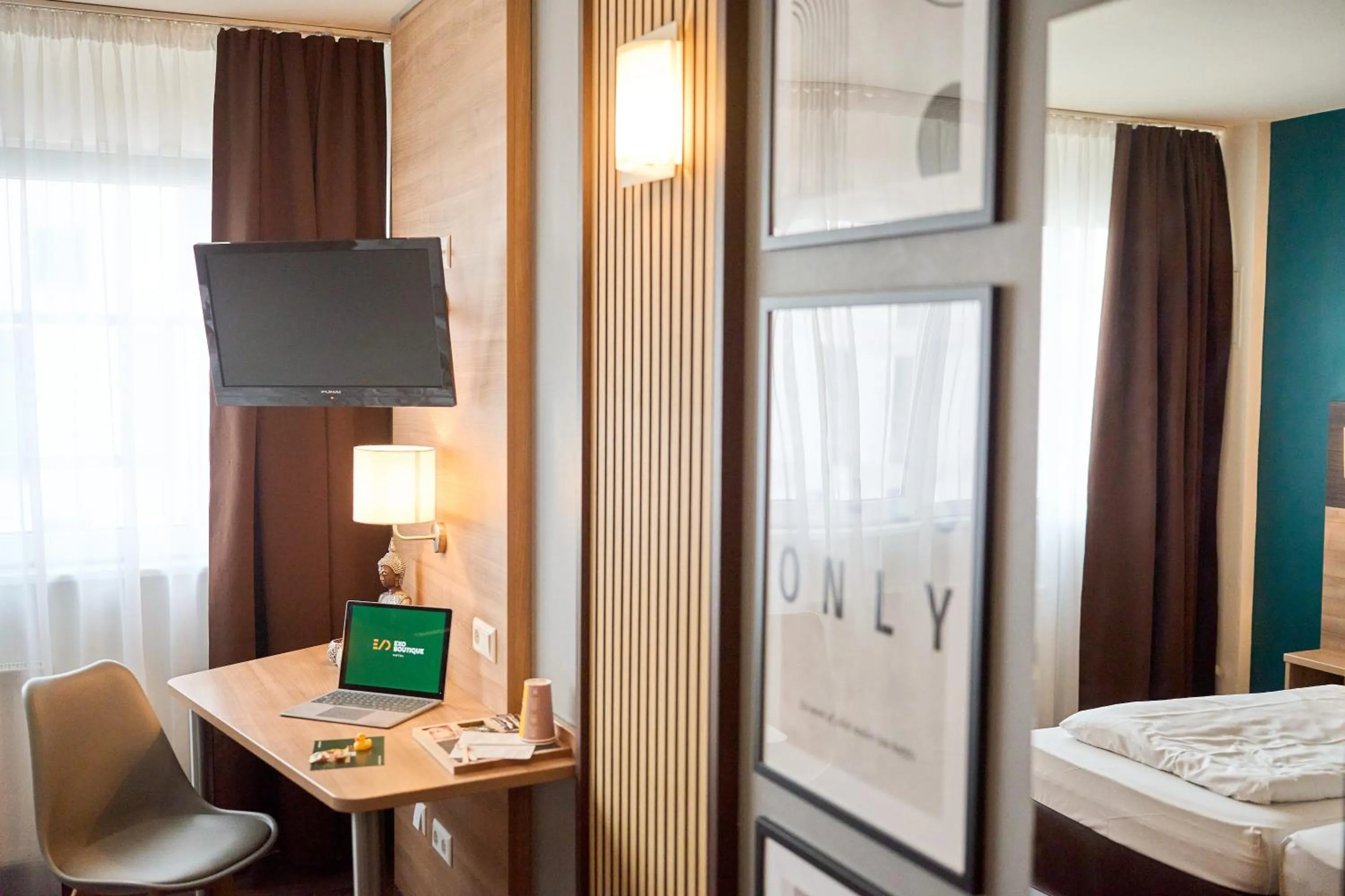 Photo of the whole room, Bed in eXo Boutique Hotel Mannheim - by SuperFly Hotels