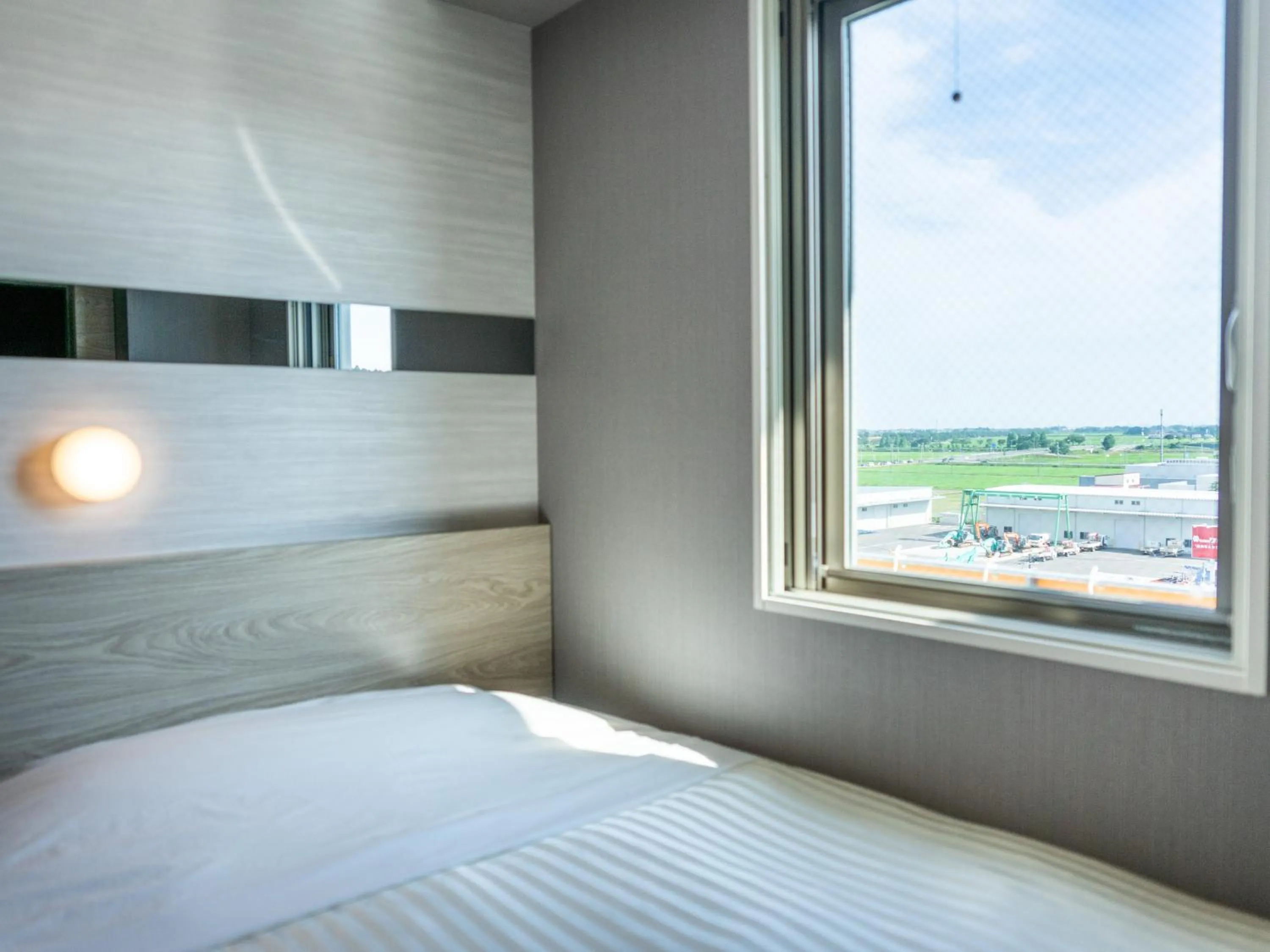 View (from property/room), Bed in Super Hotel Sendai Airport Inter