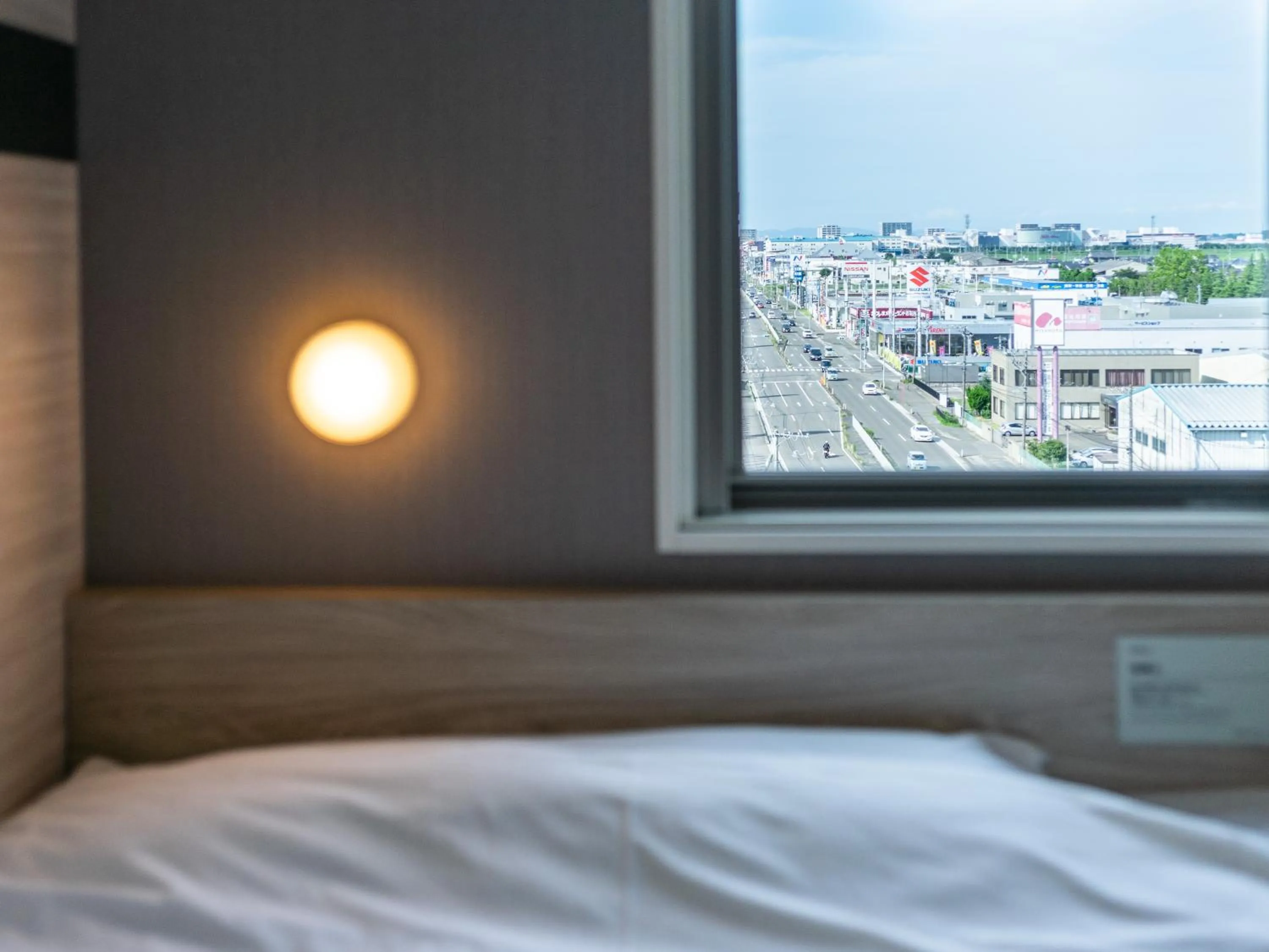 View (from property/room), Bed in Super Hotel Sendai Airport Inter