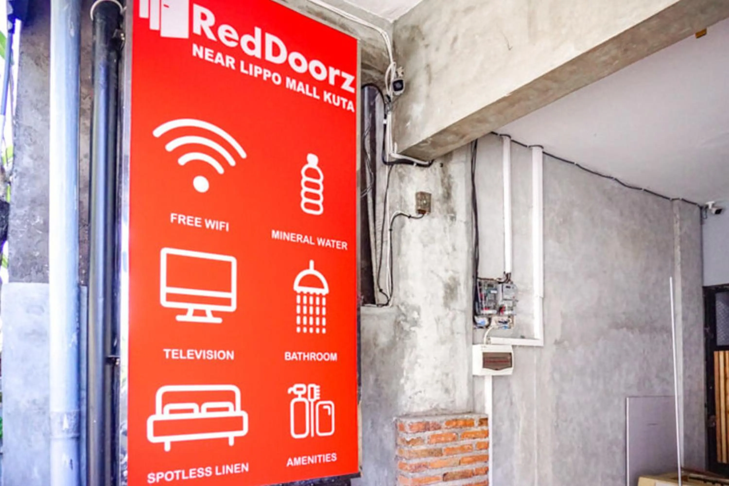 Property logo or sign in RedDoorz Hostel Near Ngurah Rai Airport Kuta