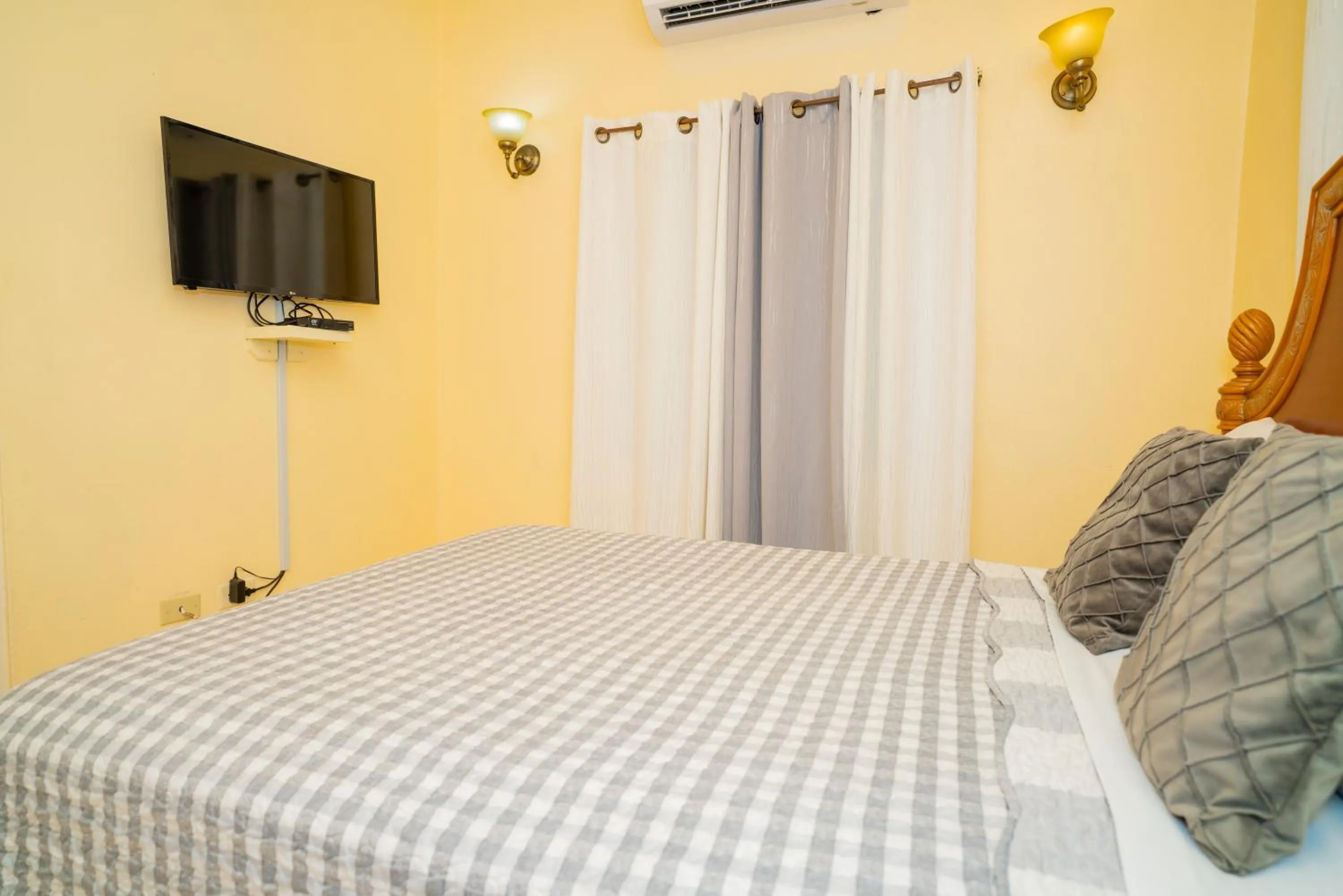 Bed in Connie's Comfort Suites