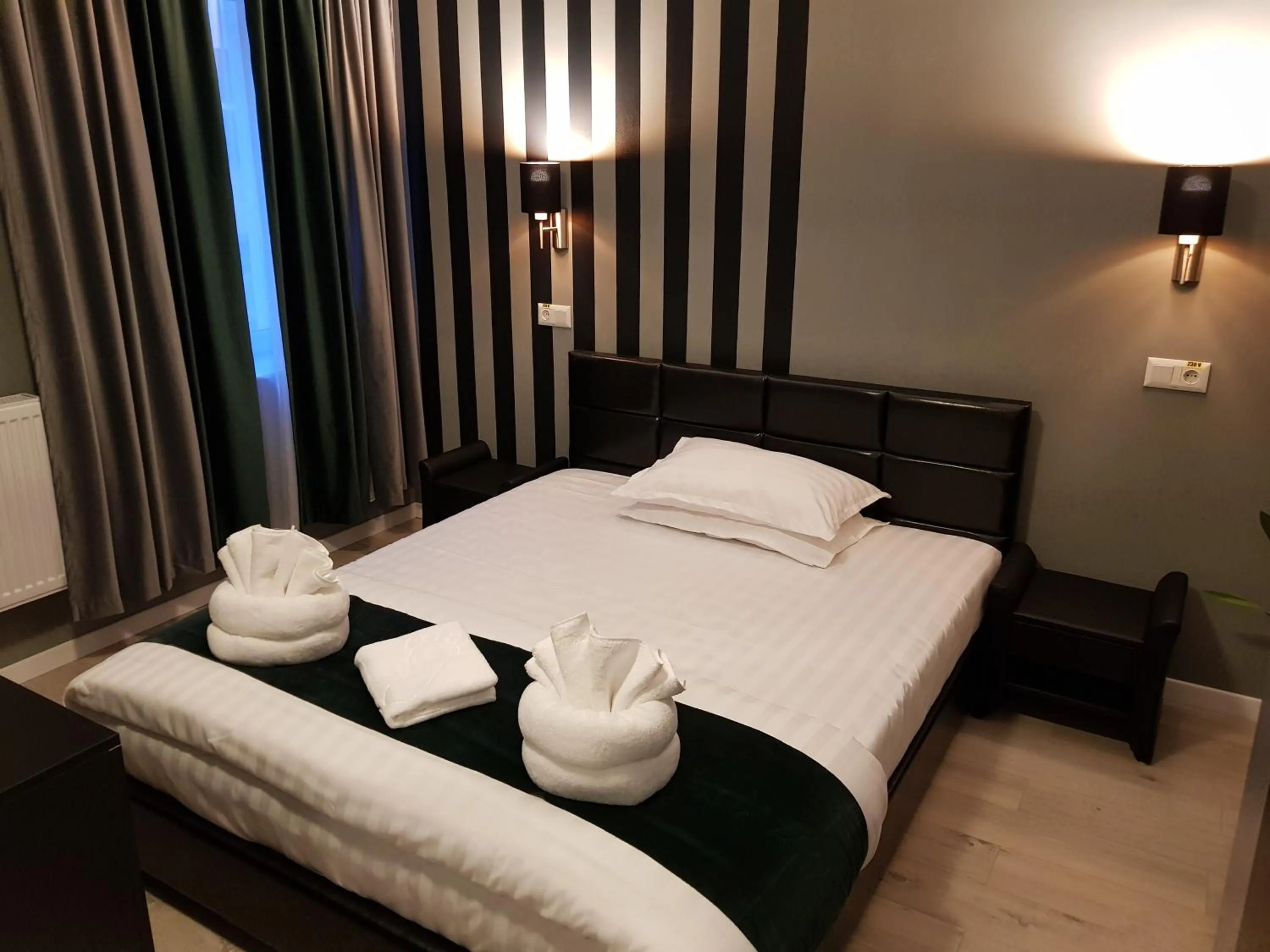 Bed in Resita Residence Hotel