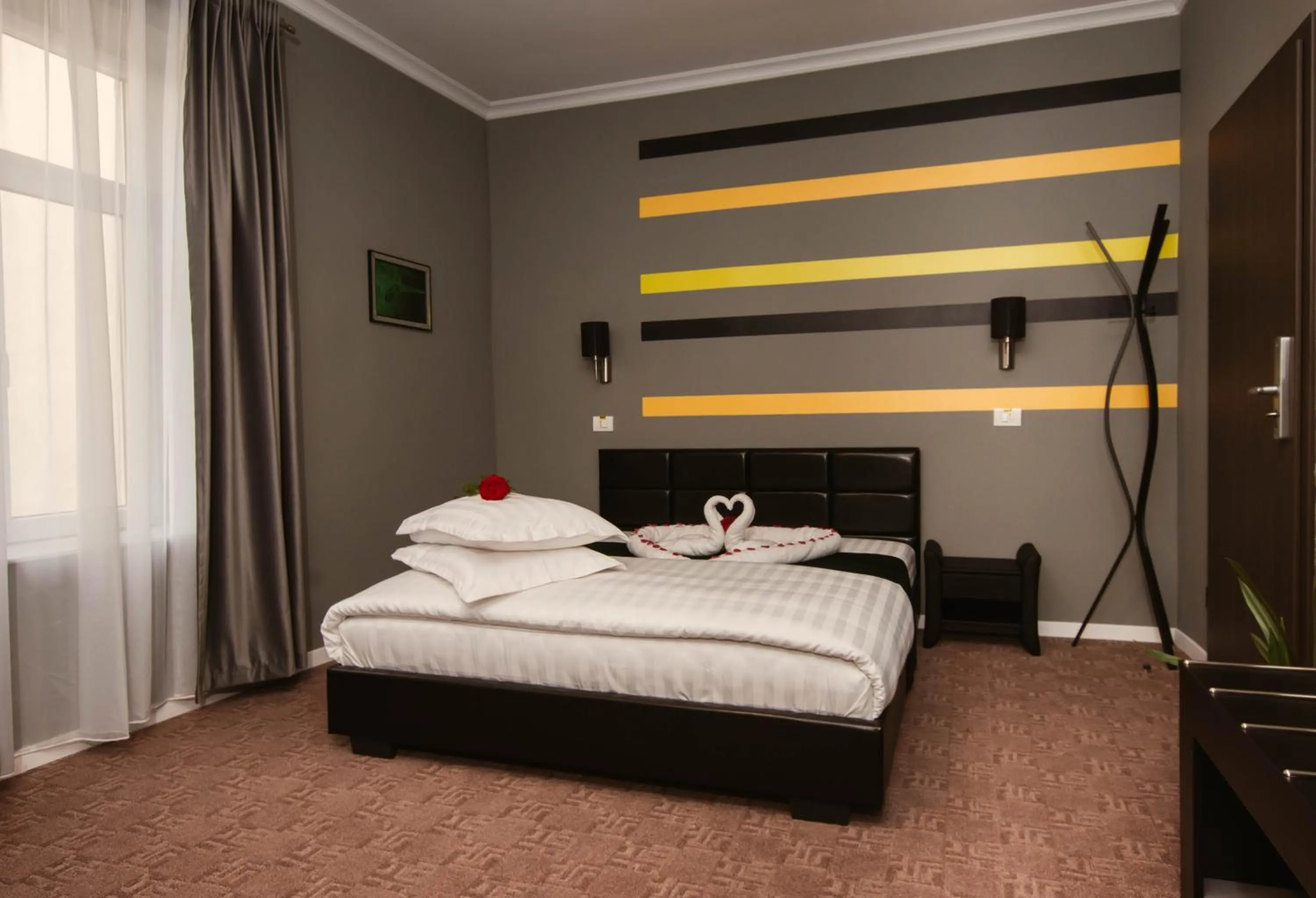 Bed in Resita Residence Hotel