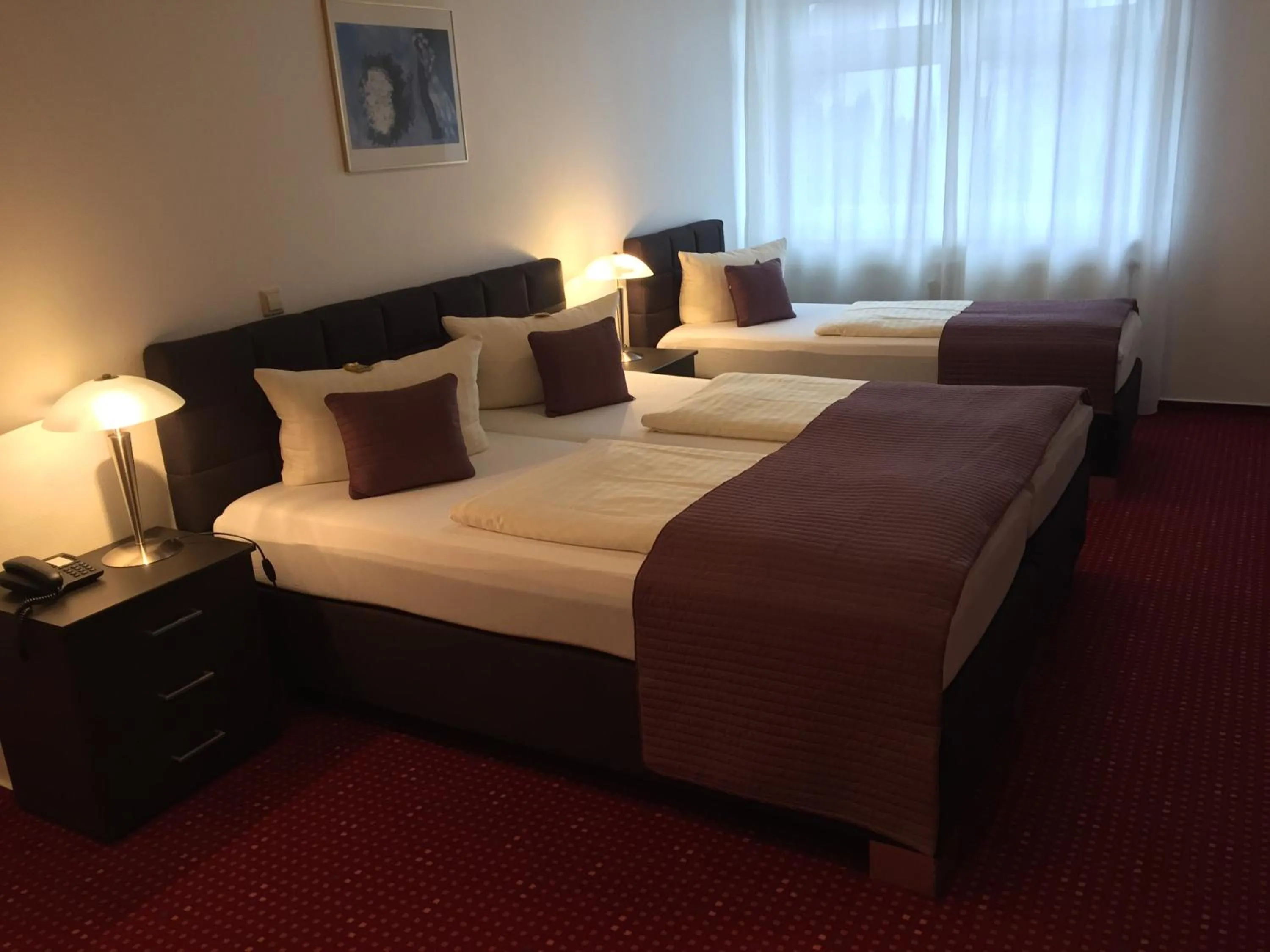 Photo of the whole room, Bed in Wincent Hotel GmbH