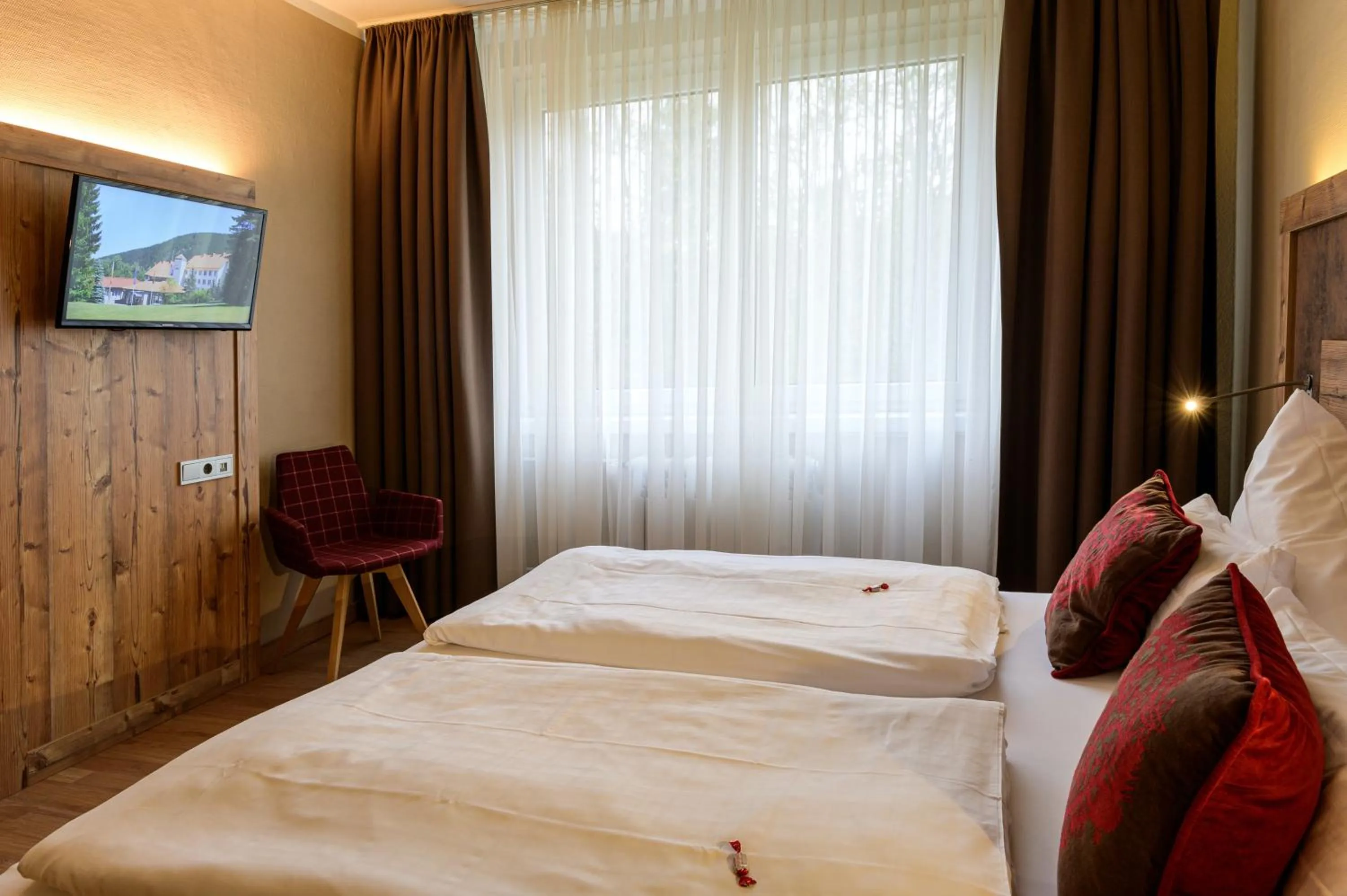 Photo of the whole room, Bed in Waldhotel Berghof