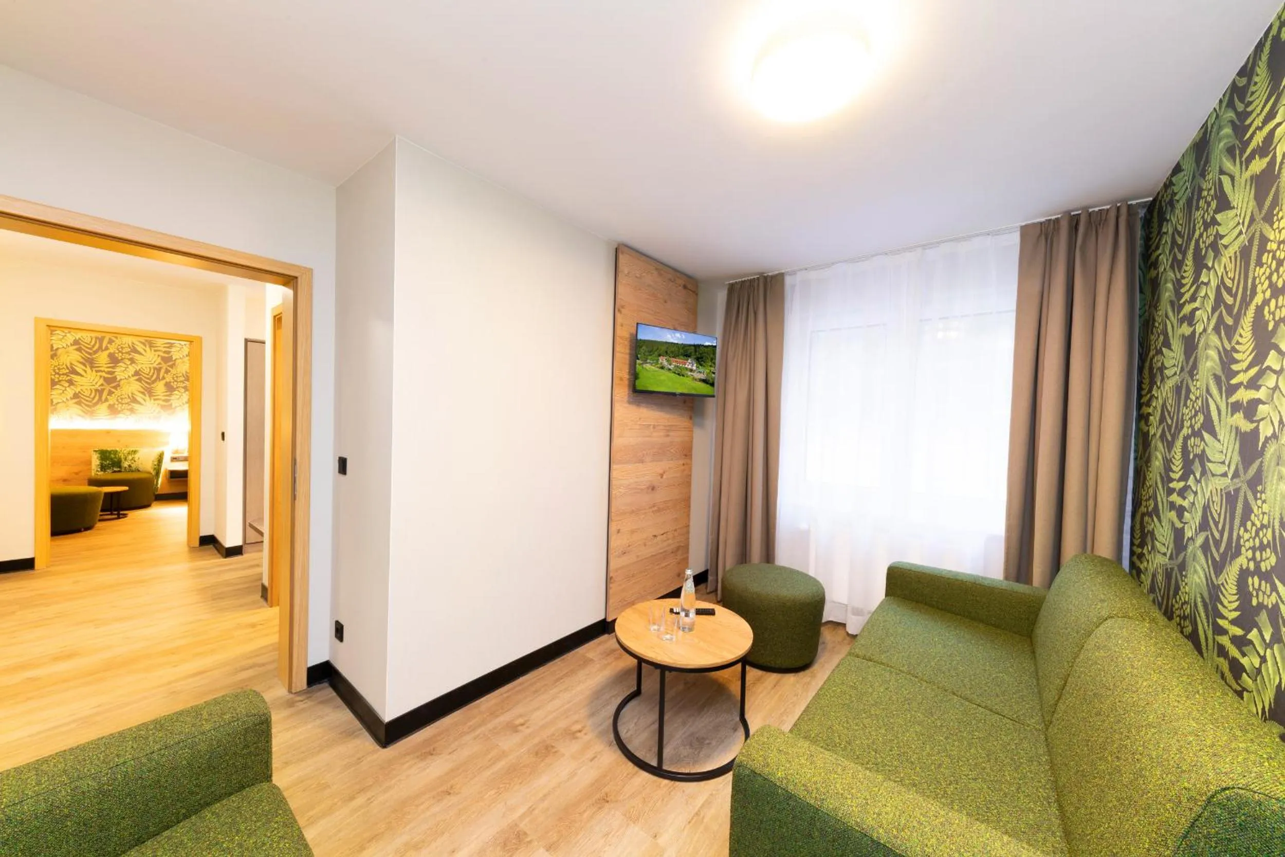 Living room, Bed in Hotel Waldmühle