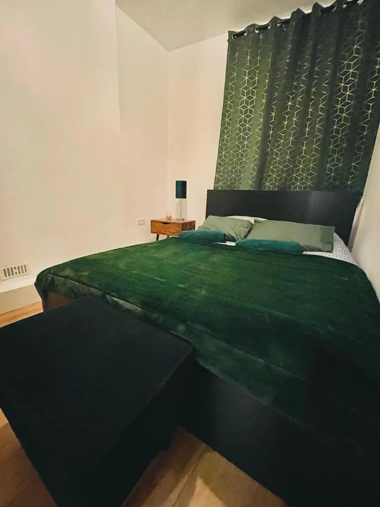 Bed in London Luxury Apartment with Private Jacuzzi Hot tub & Sauna