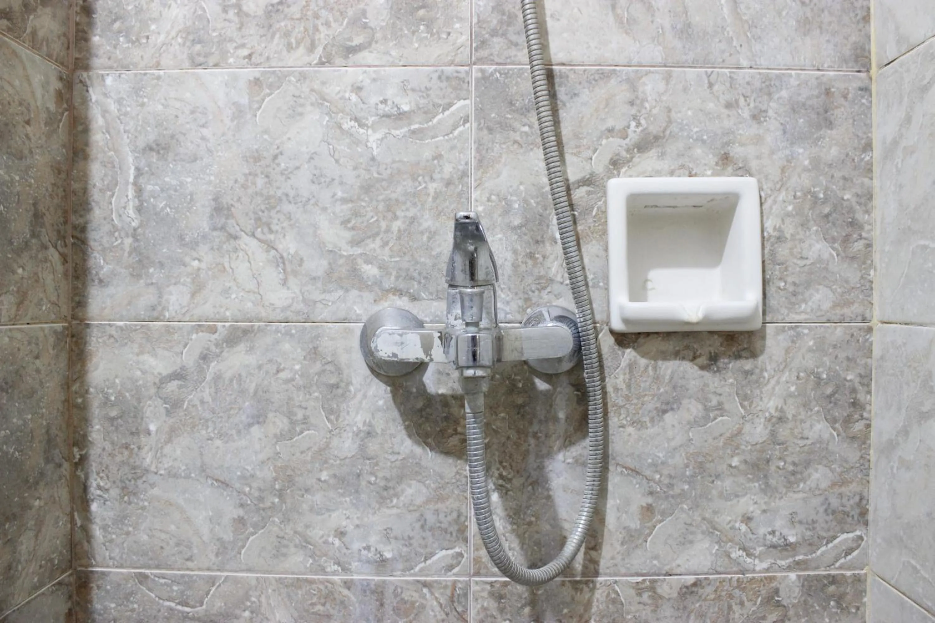 Bathroom in Deluxe & Cozy 4BR Galeri Ciumbuleuit Apartment By Travelio