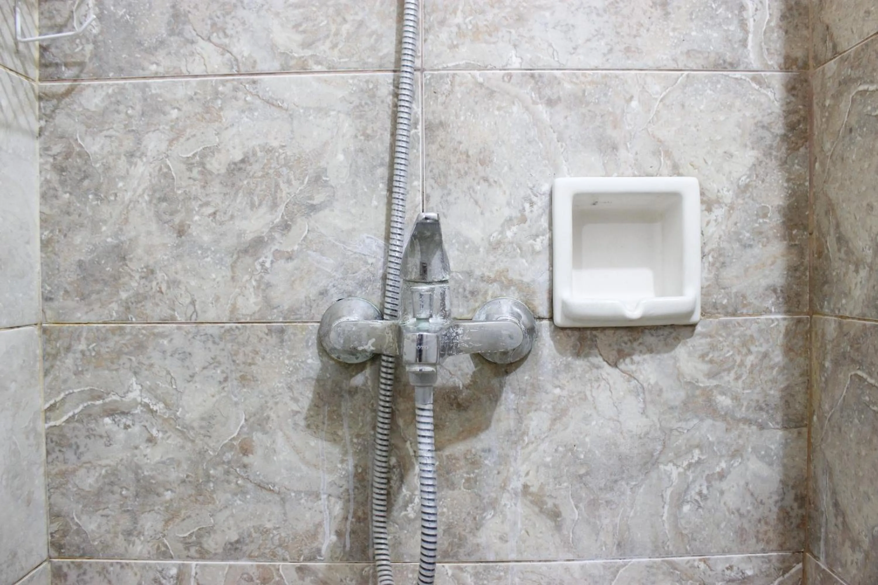 Bathroom in Deluxe & Cozy 4BR Galeri Ciumbuleuit Apartment By Travelio