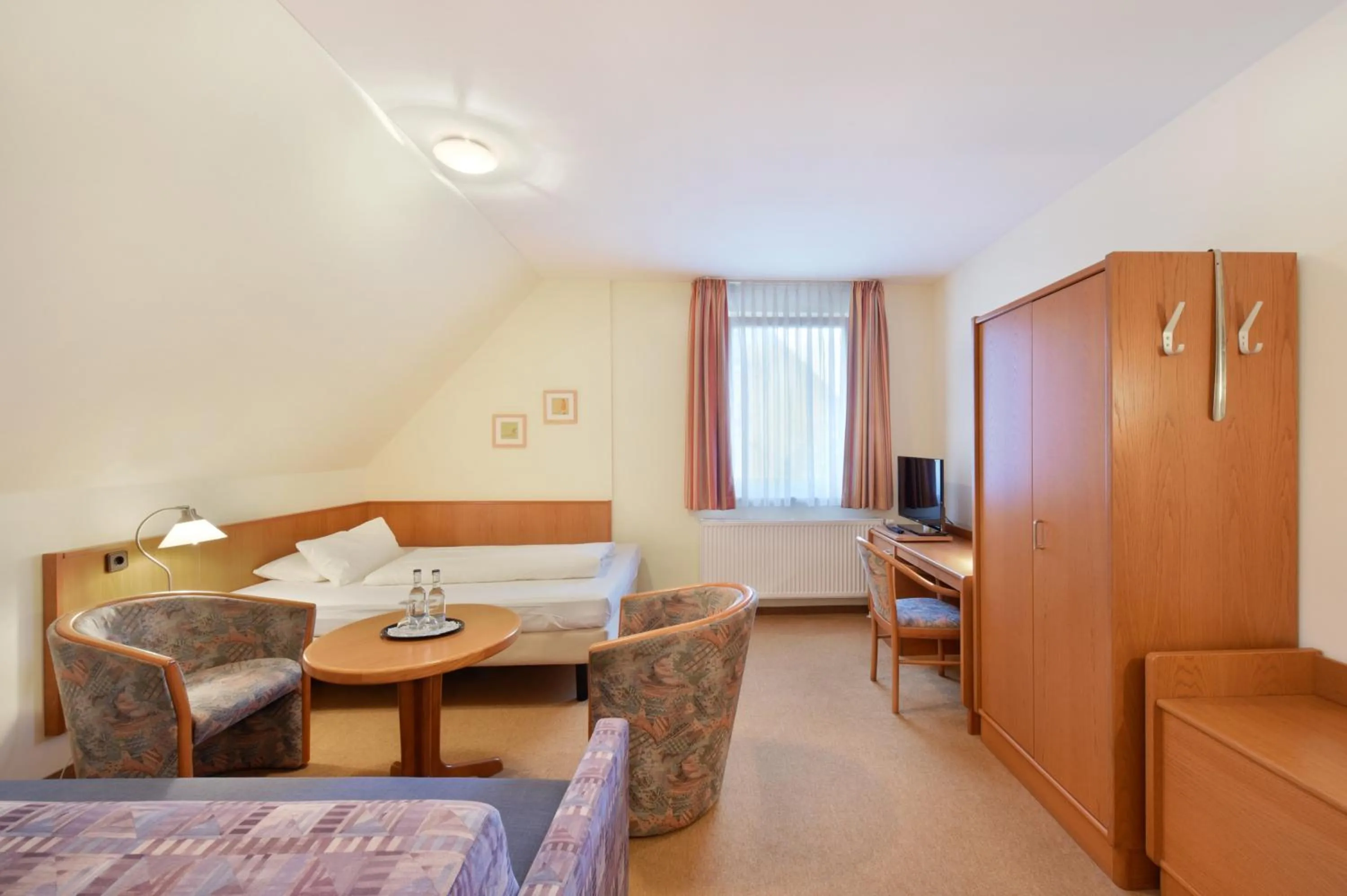 Living room, Bed in meinHotel